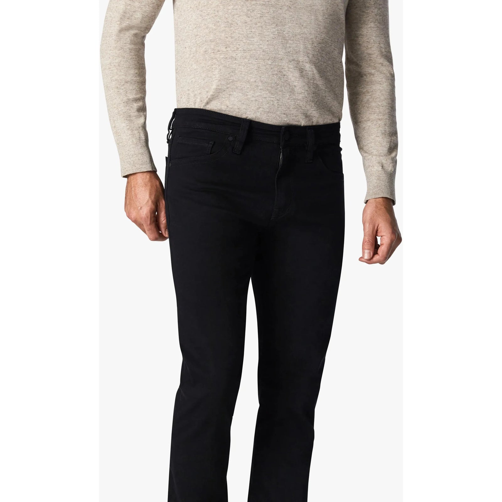 34 Heritage Courage Black Vintage Comfort jeans showcase a stylish fit, blending denim aesthetics with ultimate comfort.