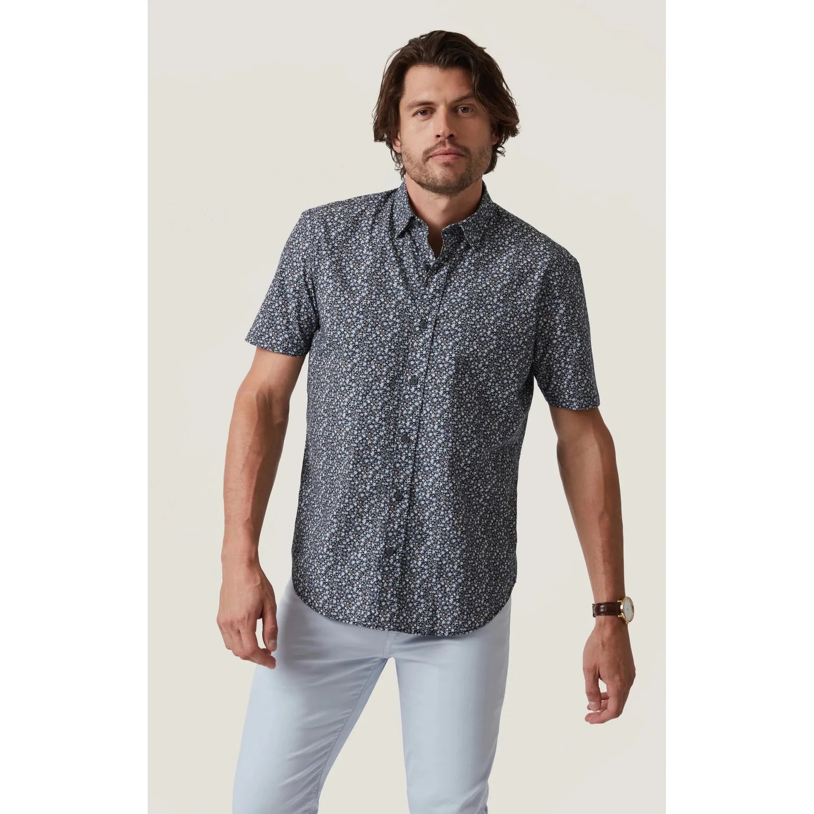 Stylish man wearing the 34 Heritage Field Short Sleeve Shirt, featuring a playful pattern perfect for warm days.