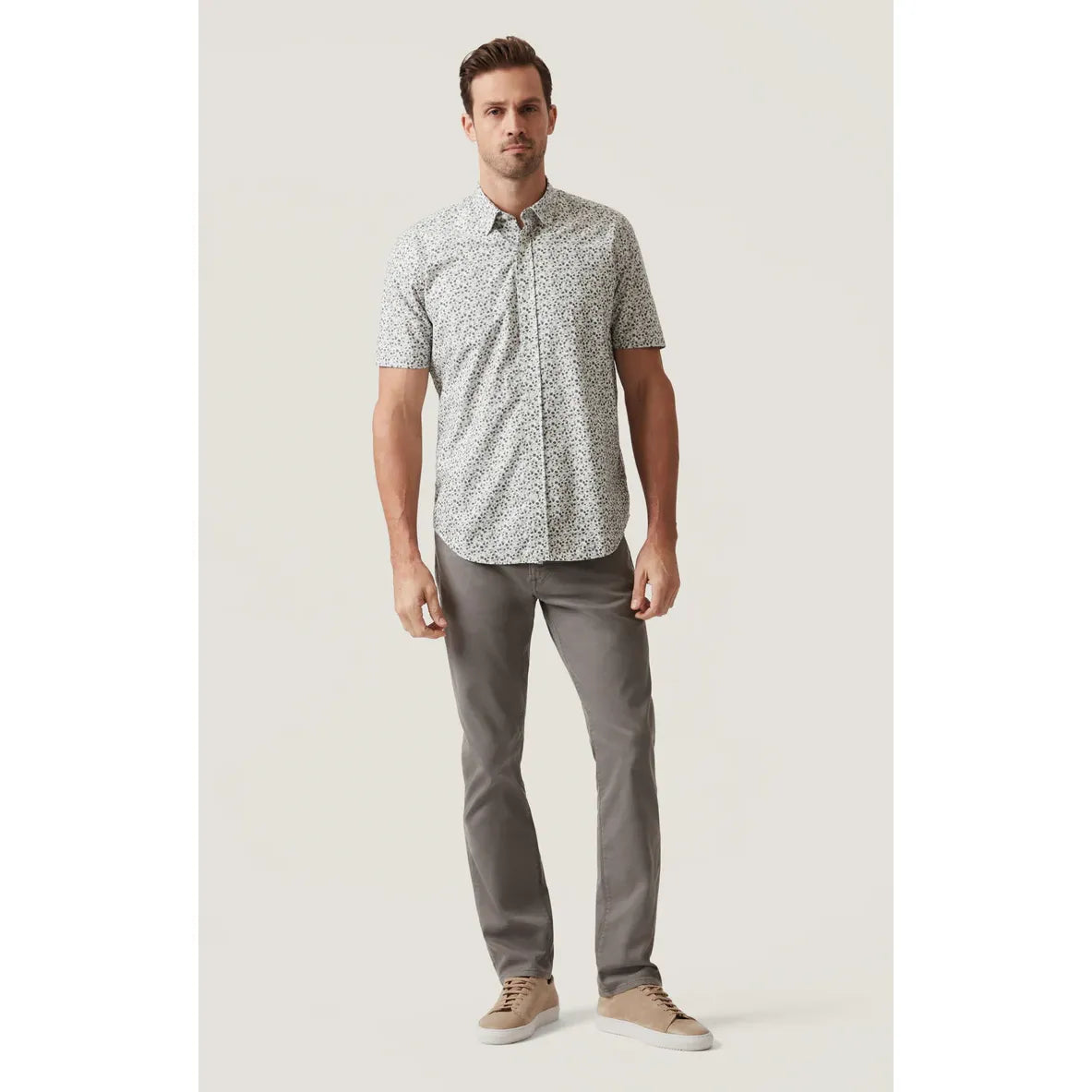 Man wearing 34 Heritage Grove Short Sleeve Shirt with a small floral print; breathable cotton-Tencel blend.