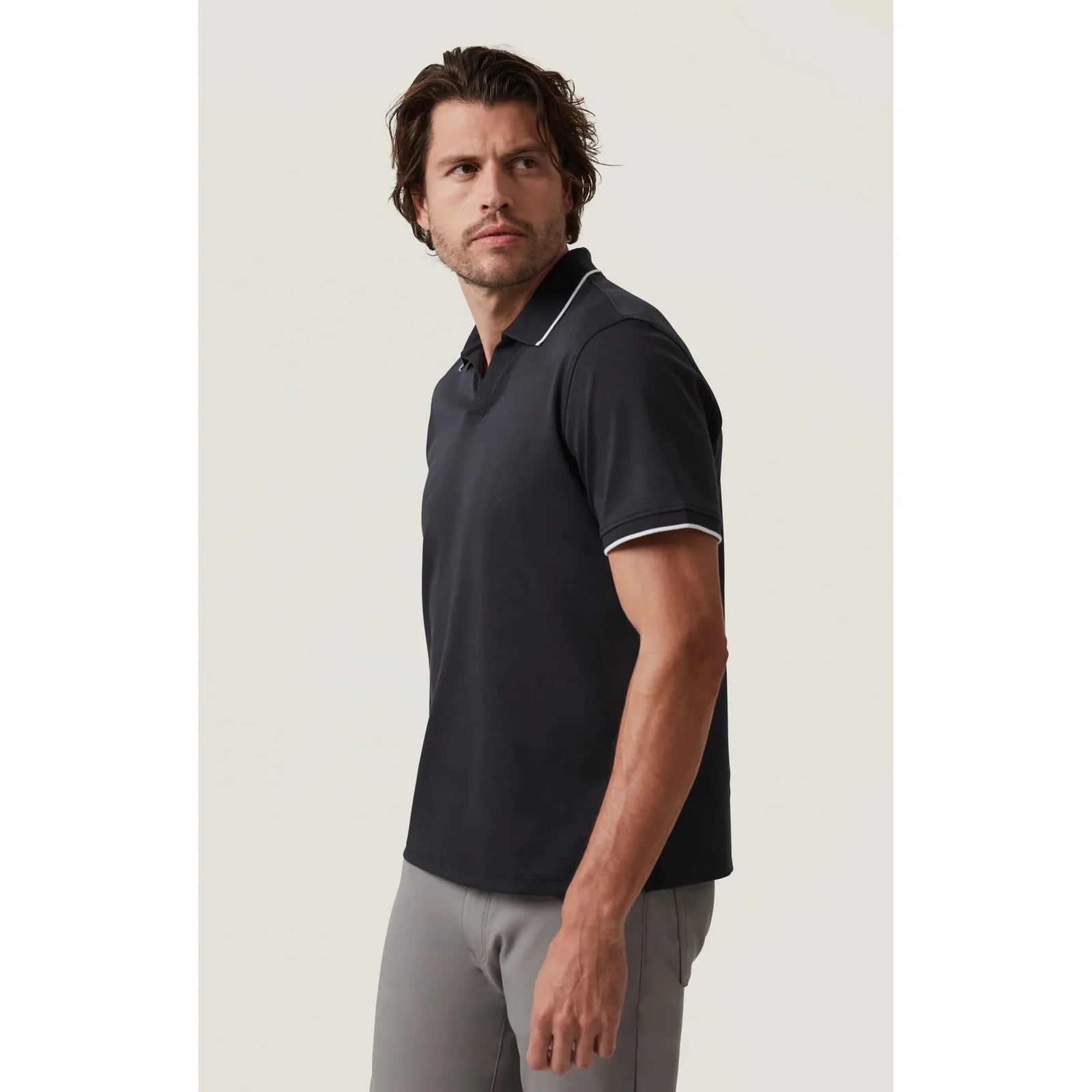 Elevate your style with the 34 Heritage Riviera Polo, featuring sleek white accents for a modern look.