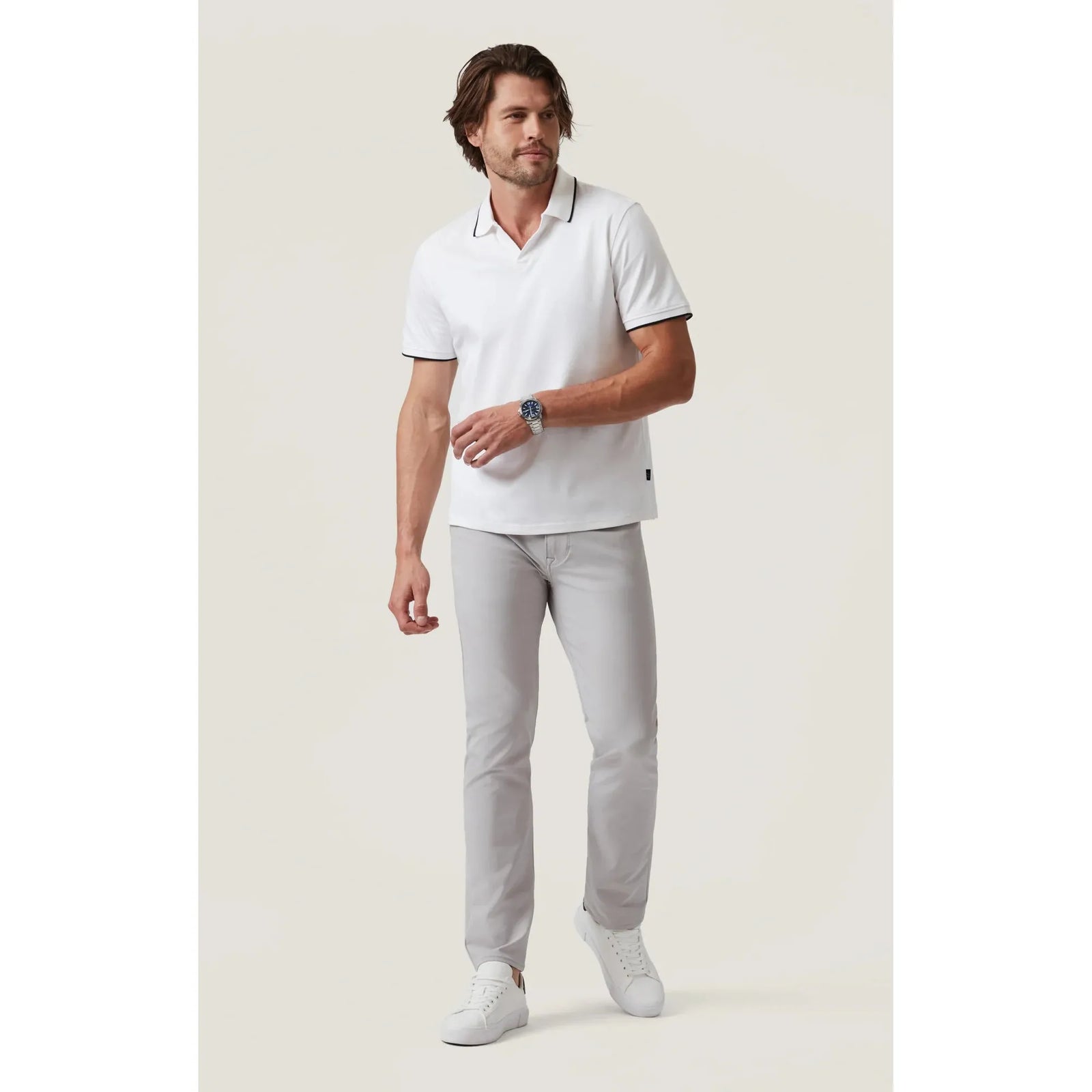 Elevate your style with the 34 Heritage Riviera Polo's sleek design and contrasting white detailing. Perfect for any occasion.