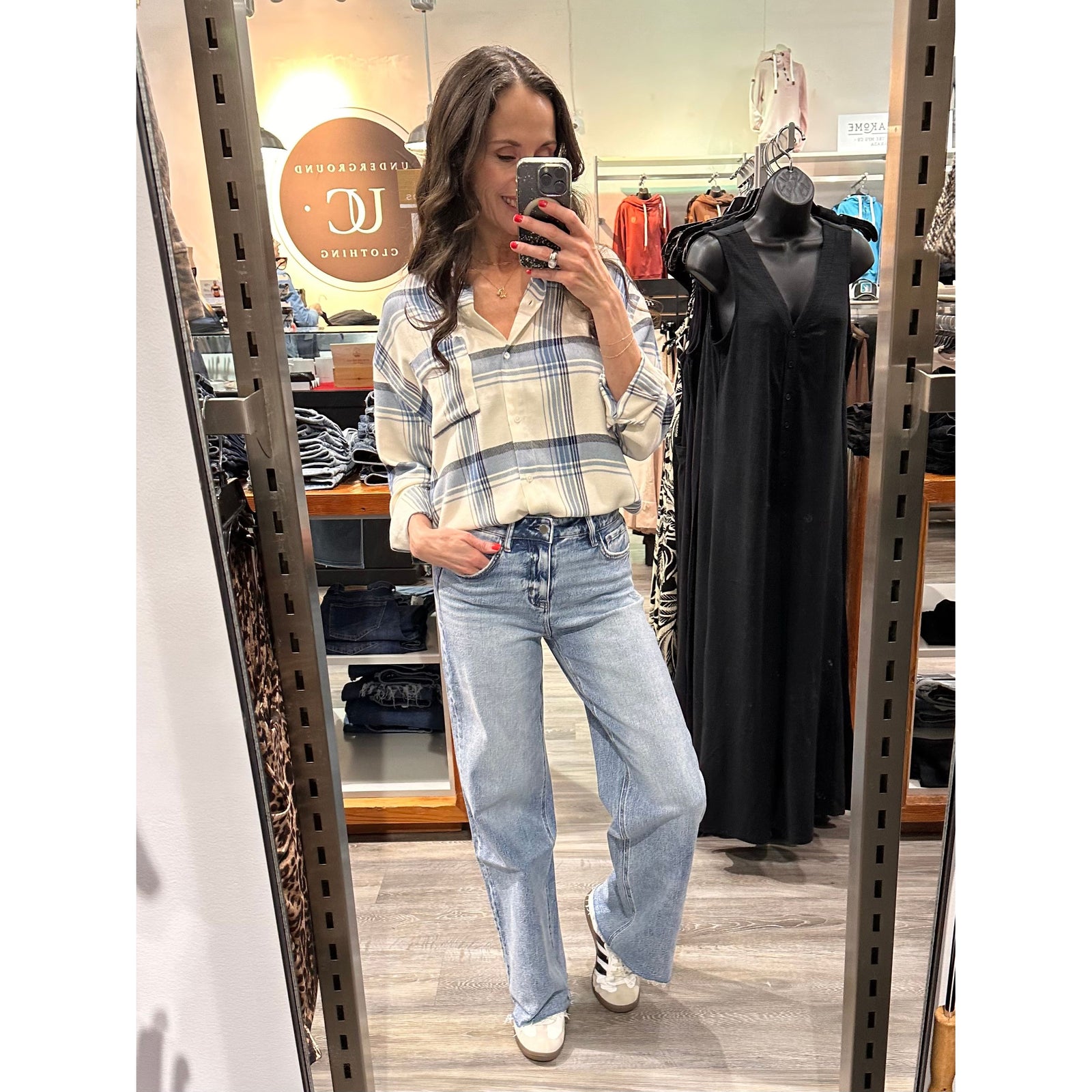 Model wearing Z Supply River Plaid Button Up Top with light-wash jeans in a casual store look.