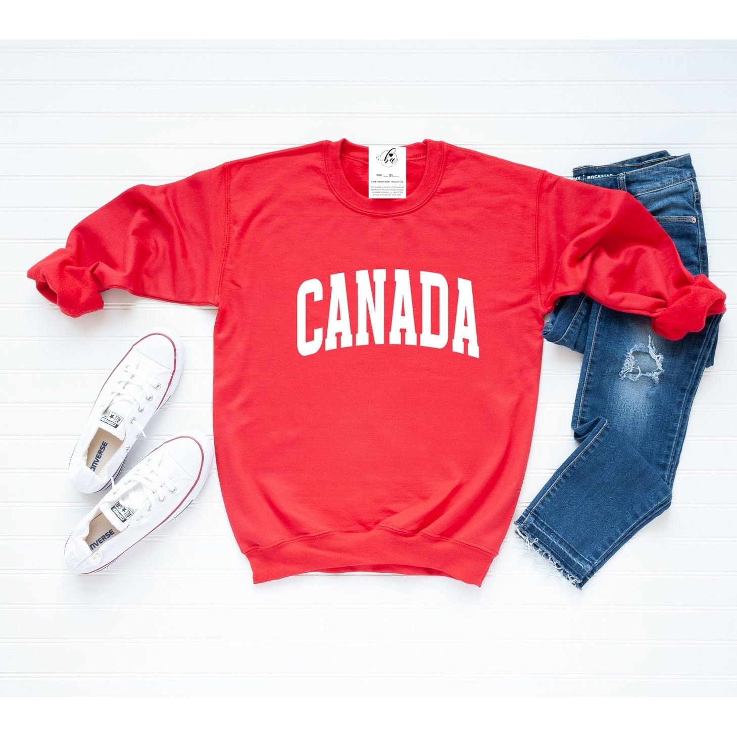 Cozy up in the Canada Cozy Crew, a stylish red sweater perfect for everyday wear and made in Canada.