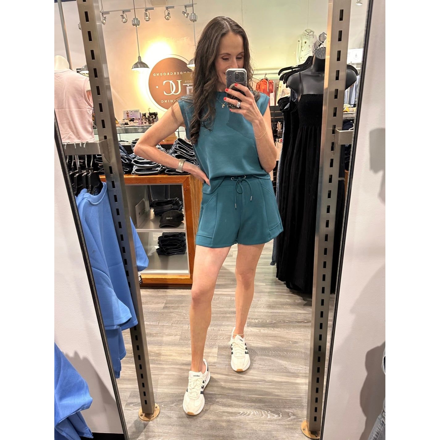 Scuba Senza Soft Knit Shorts in teal with pockets, model Sharlen in size small - Senza.