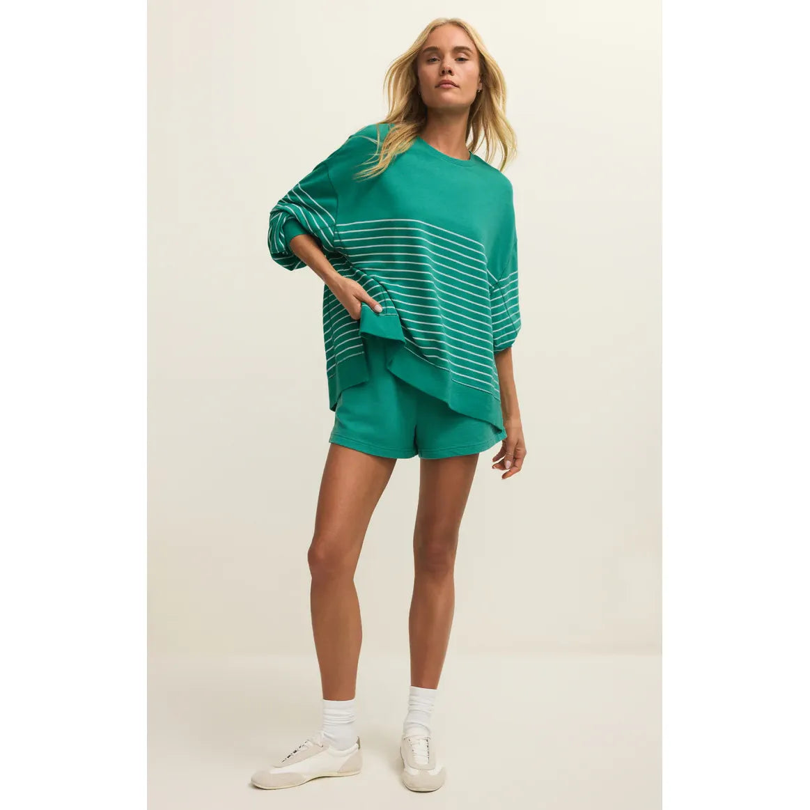 Z Supply Modern Weekender Stripe Sweatshirt in green with white stripes, paired with matching green shorts.