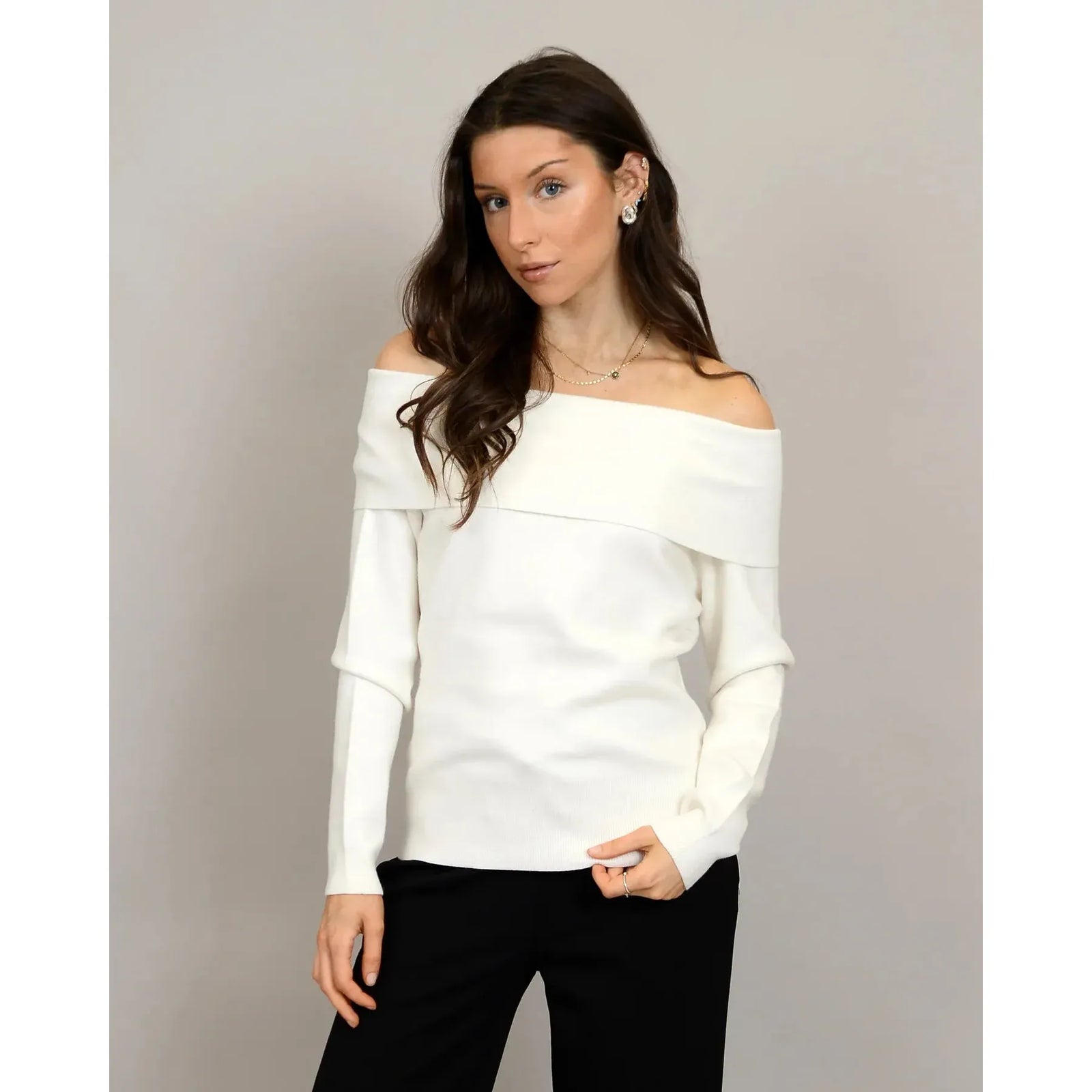 Angelique Raglan Long Sleeve Sweater on a model in ivory knit with off-shoulder neckline and extended sleeves.