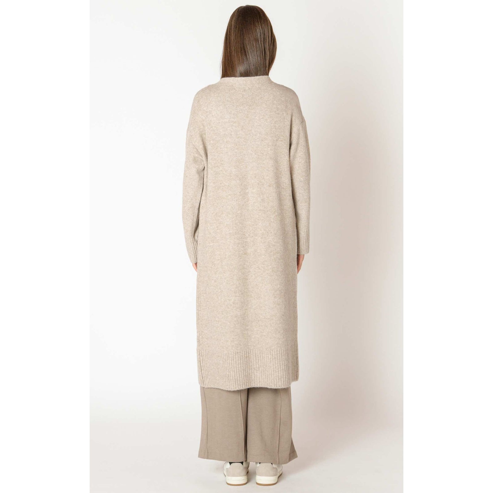 Dex Black Tape Longline open cardigan, beige knit, back view on model, relaxed open-front, ribbed hem.