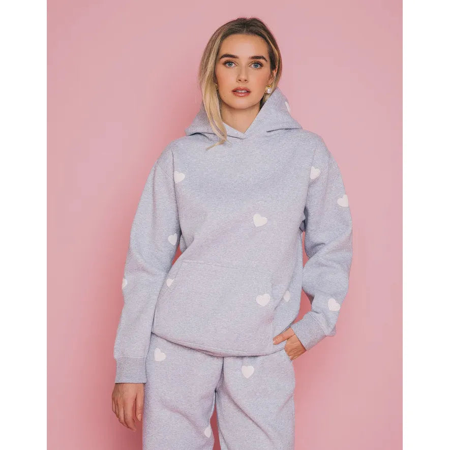 Brunette the Label All Over Heart Core Hoodie in light gray with white hearts, relaxed fit.