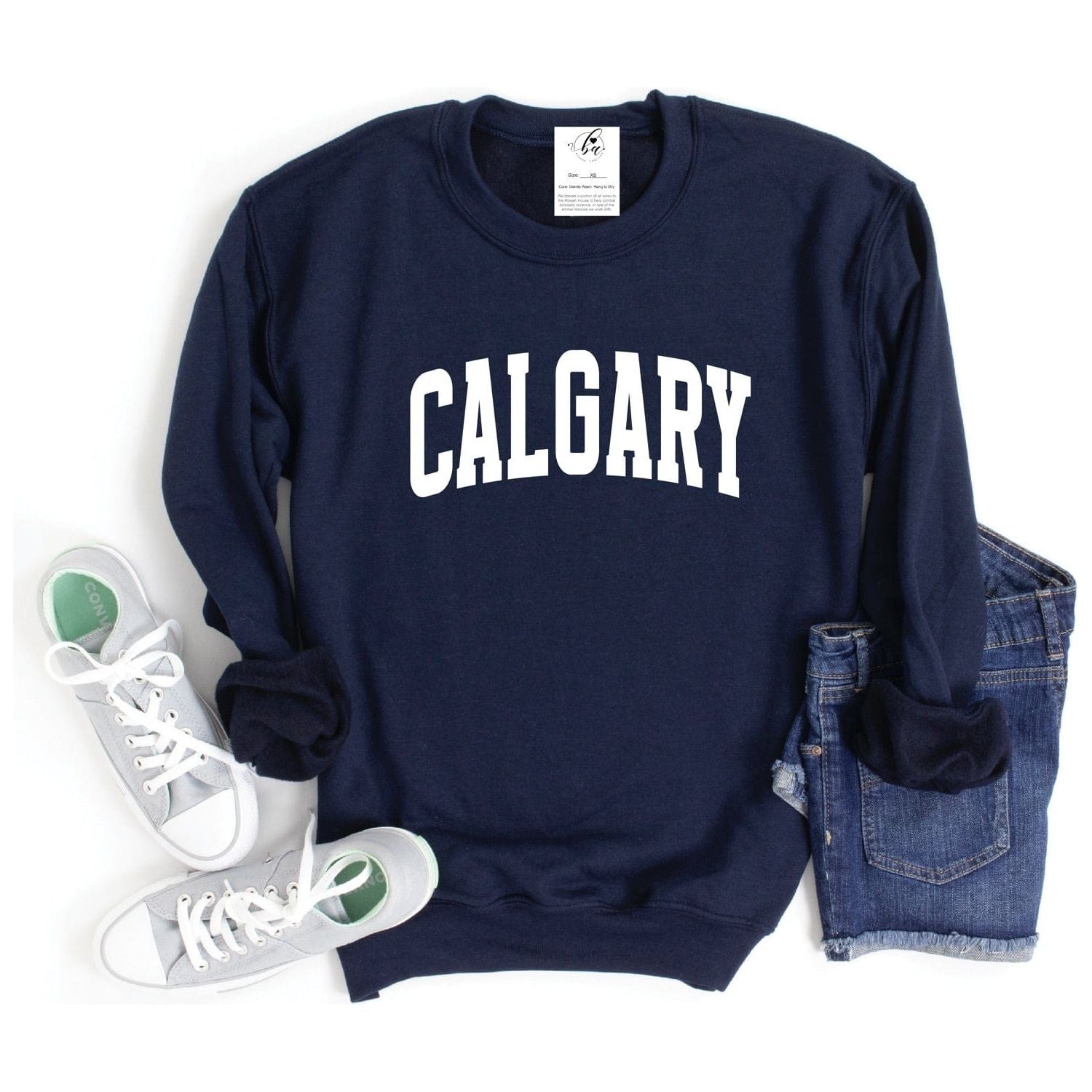 Stay warm and stylish in the Calgary Cozy Crew, perfect for chilly days and celebrating your hometown pride.