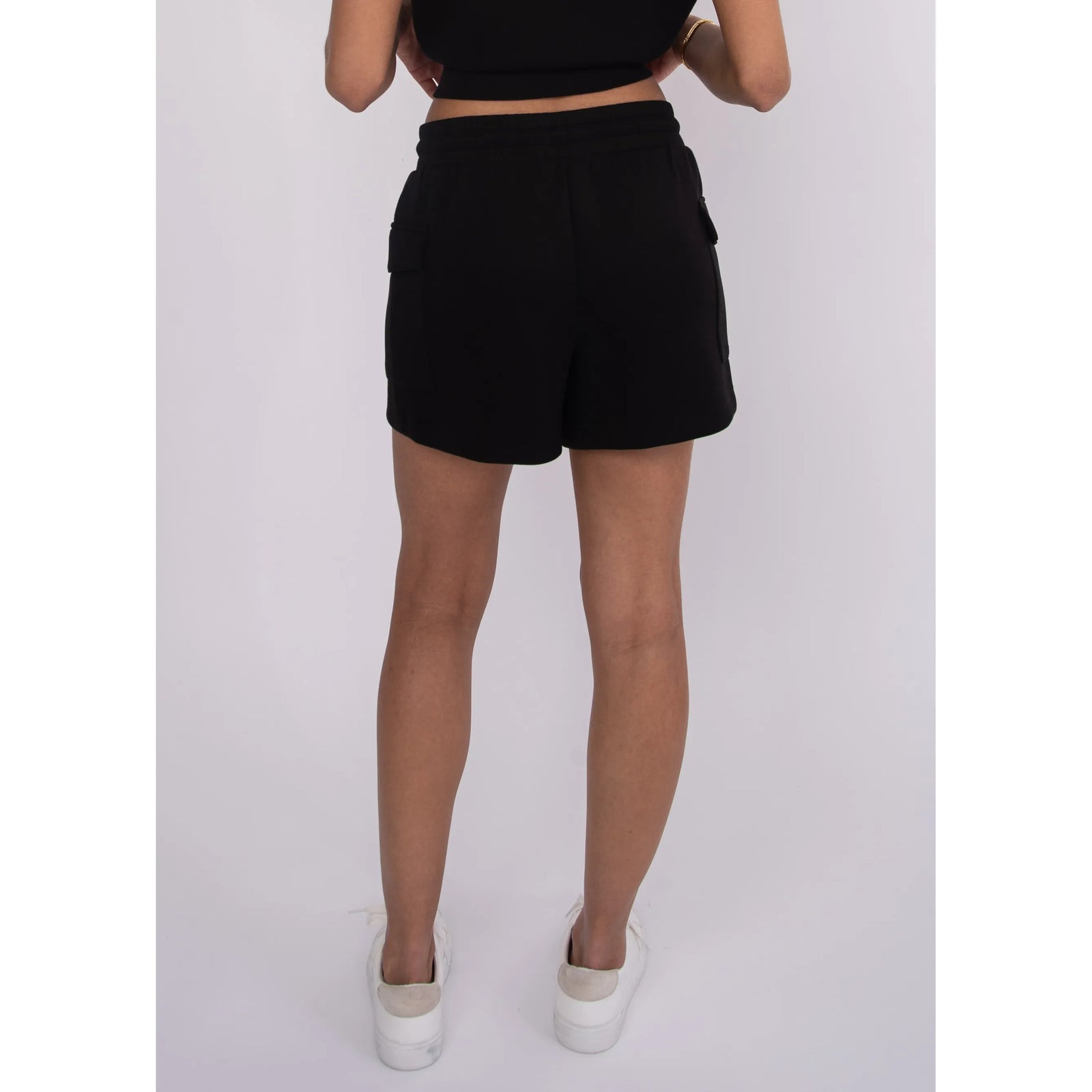 Darcia Soft Knit Drawstring Shorts in black with side pockets and elastic drawstring waist