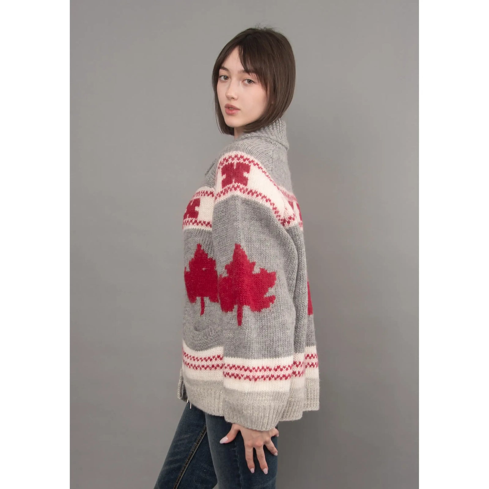 Grey knit daria raglan shawl collar sweater featuring red maple leaf motifs and white patterned bands.