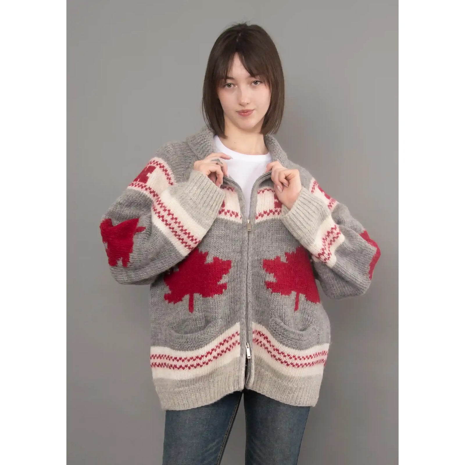 Gray Daria raglan shawl collar sweater with red maple leaf intarsia pattern, zip front, and cozy knit texture.