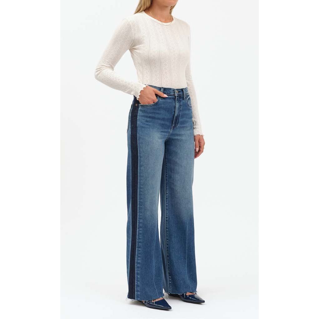 Daze Far Out High Rise Wide Leg jeans with black tuxedo stripes down each leg, paired with a white knit top.