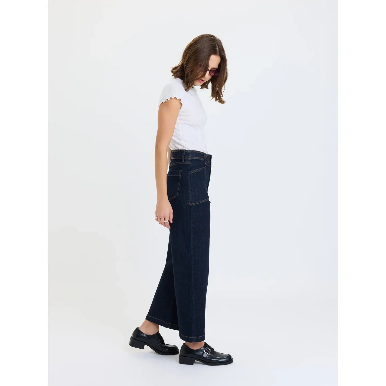High-rise wide leg ankle jeans in rinse featuring vintage front patch pockets, deep indigo wash, and comfort stretch denim.