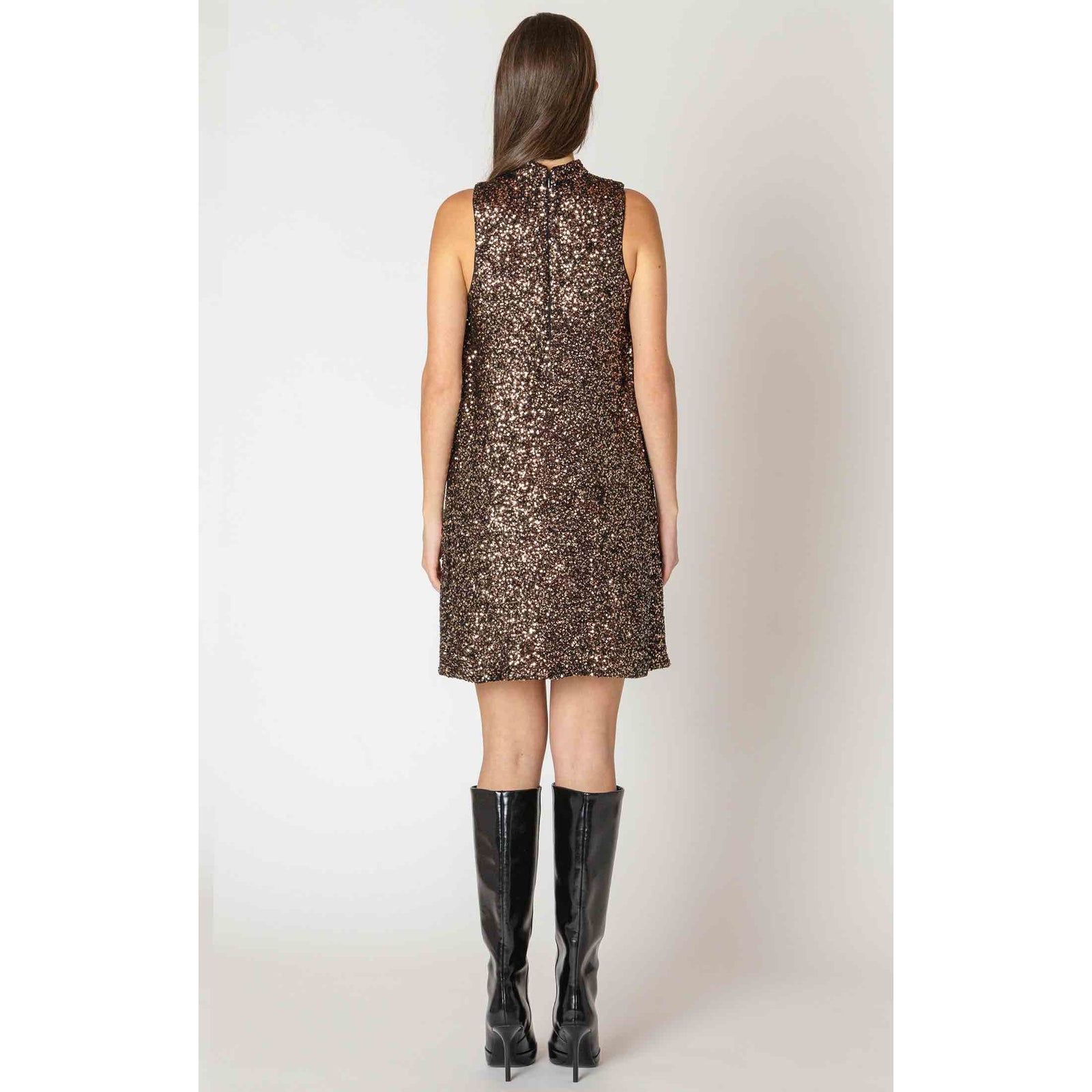 Back view of Dex Black Tape Mock Sequin Dress in bronze-black sequins, knee-length with black boots.