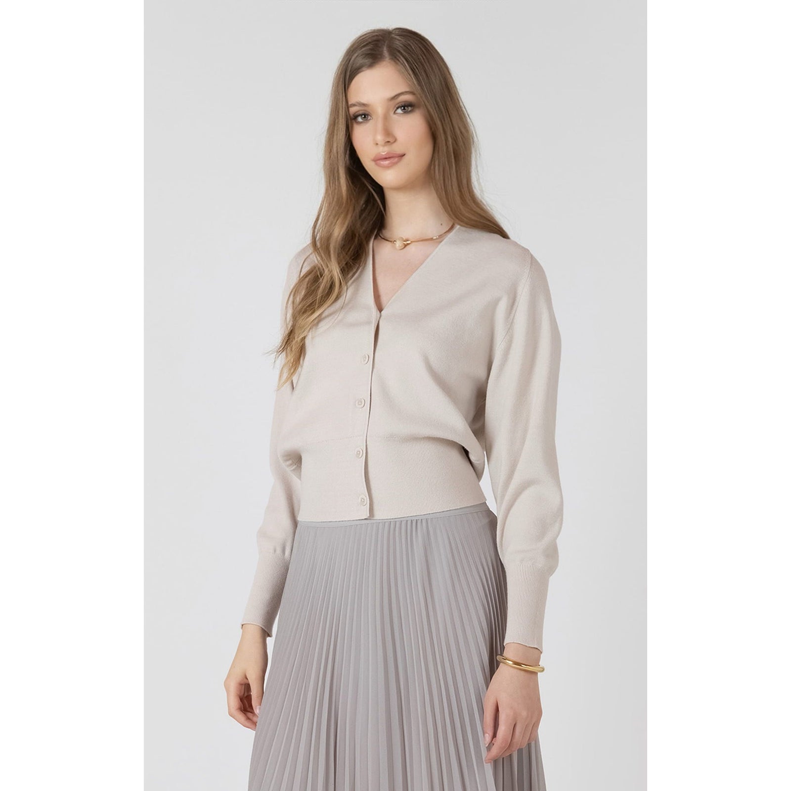 Dex Button Front Cardigan in beige on model, V-neck, button-front with ribbed hem.