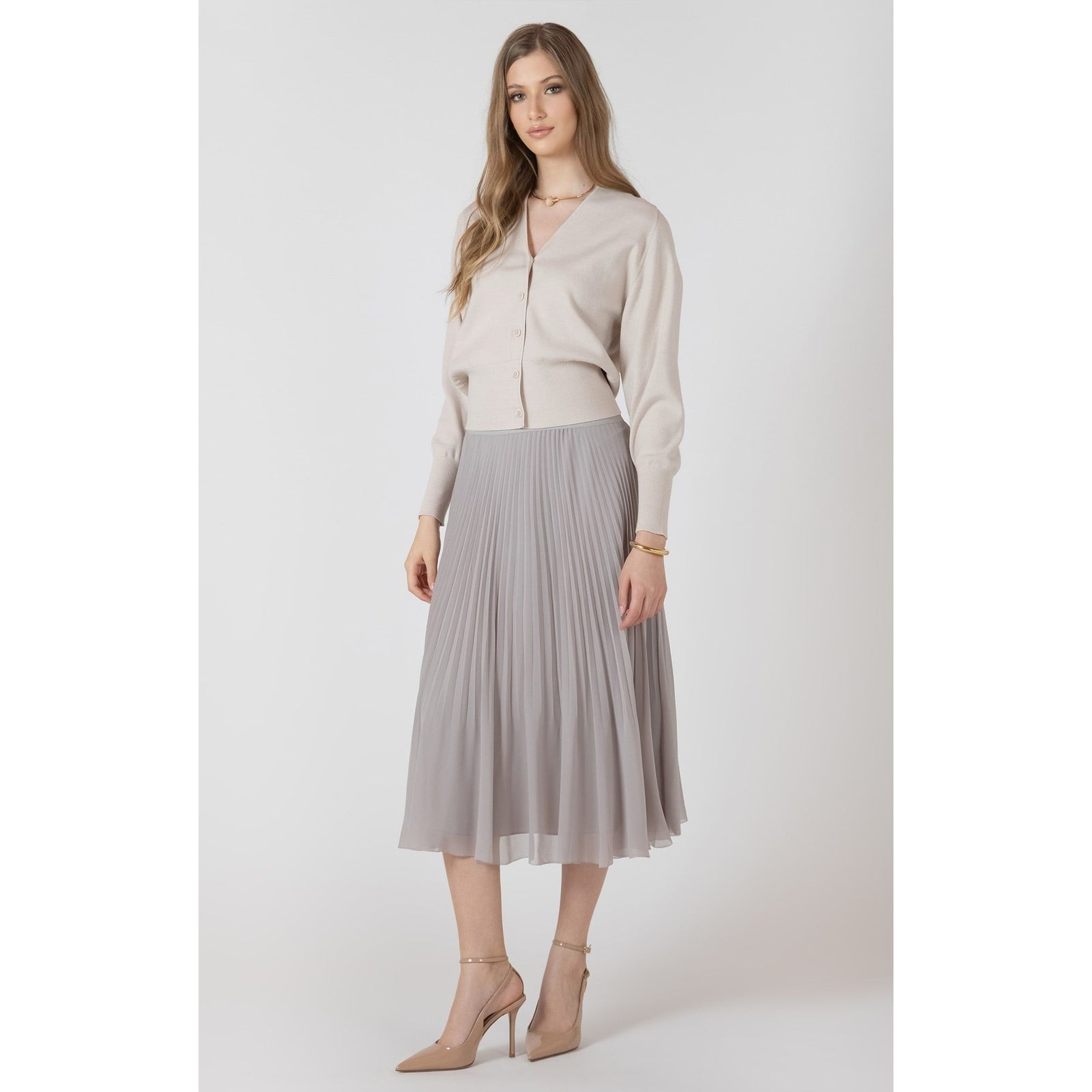 Beige Dex Button Front Cardigan styled with a light gray pleated midi skirt.