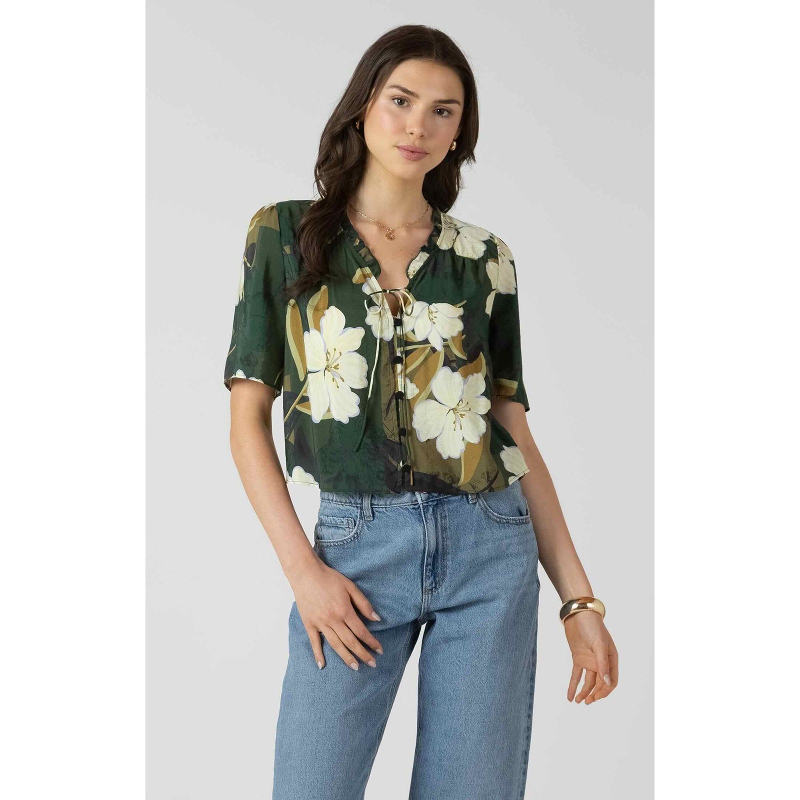 Dex Button Front Ruffle Trim Blouse in green floral print with front button closure and short sleeves.