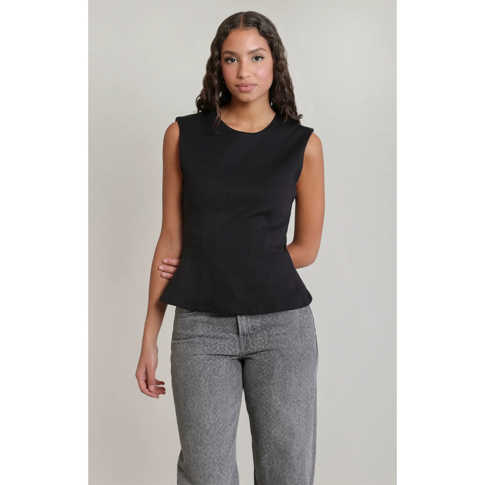 Black sleeveless cinch waist top with a scoop neck and corset-style detailing, made from soft modal-cotton blend.