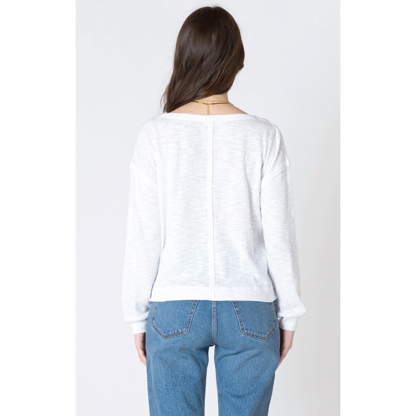 Cozy in the Dex Crew Neck Sweatshirt, featuring a ribbed neckline and chic patch pocket for a stylish look.