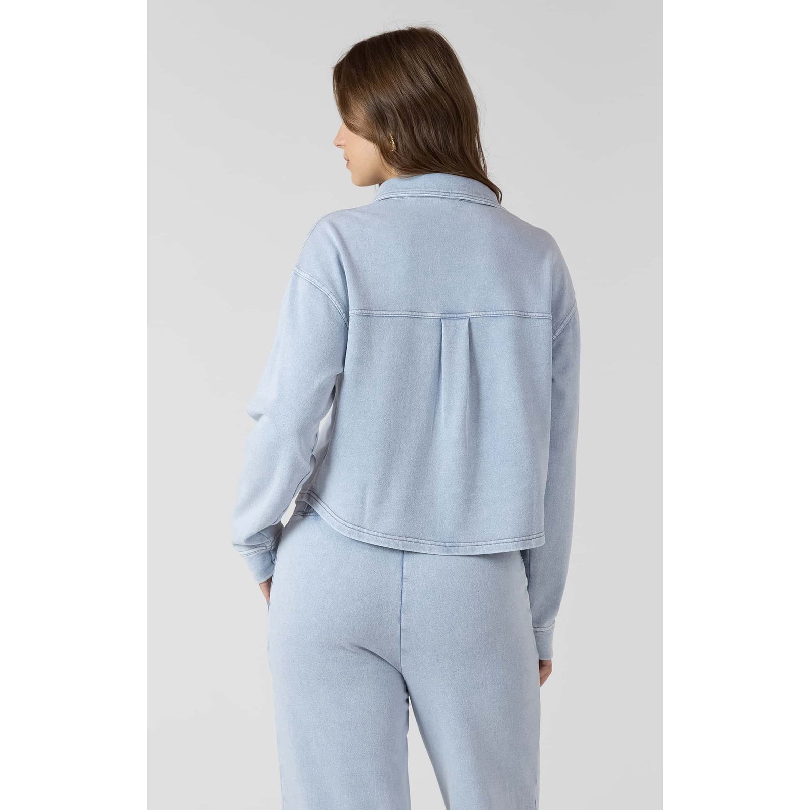 Dex Cropped Knit Overshirt in washed light denim, back view showing cropped hem and seam details.