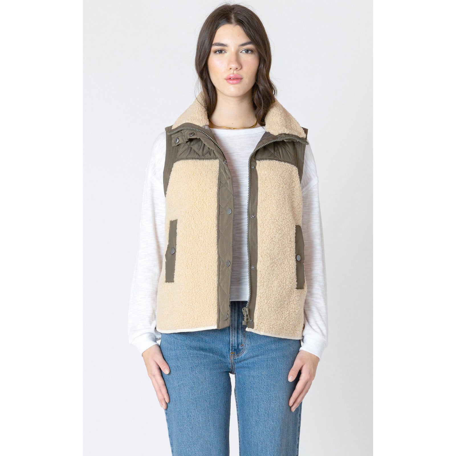Stay cozy this season in the Dex Mixed Fabric Vest, featuring plush SHERPA trim and a stylish quilted design.