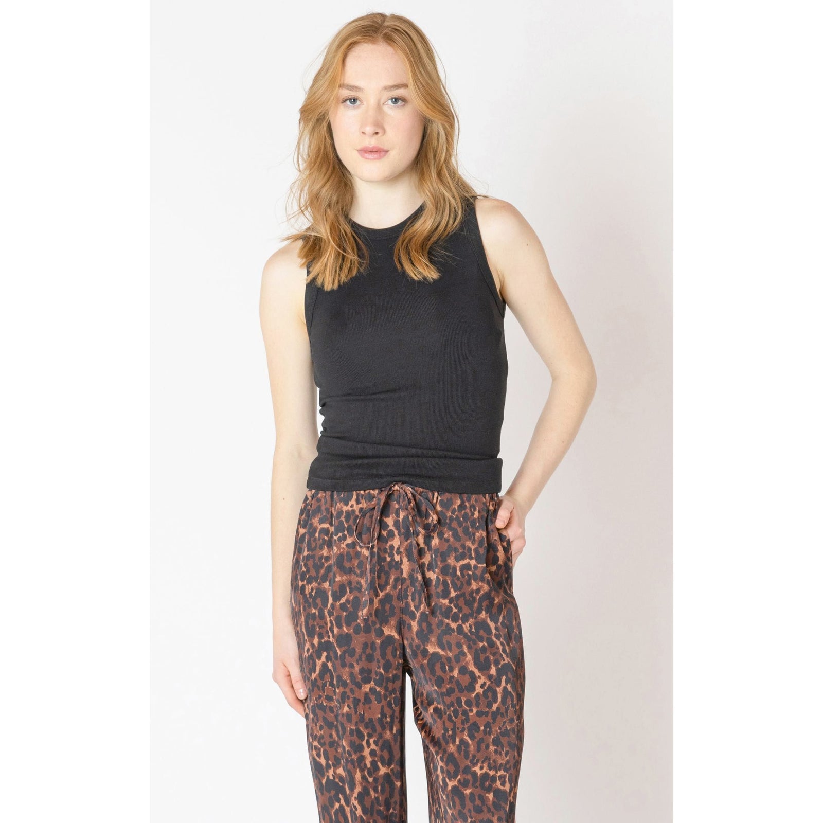 Shop the stylish Dex Ribbed Tank Top in black, perfect for layering or casual wear with any outfit.