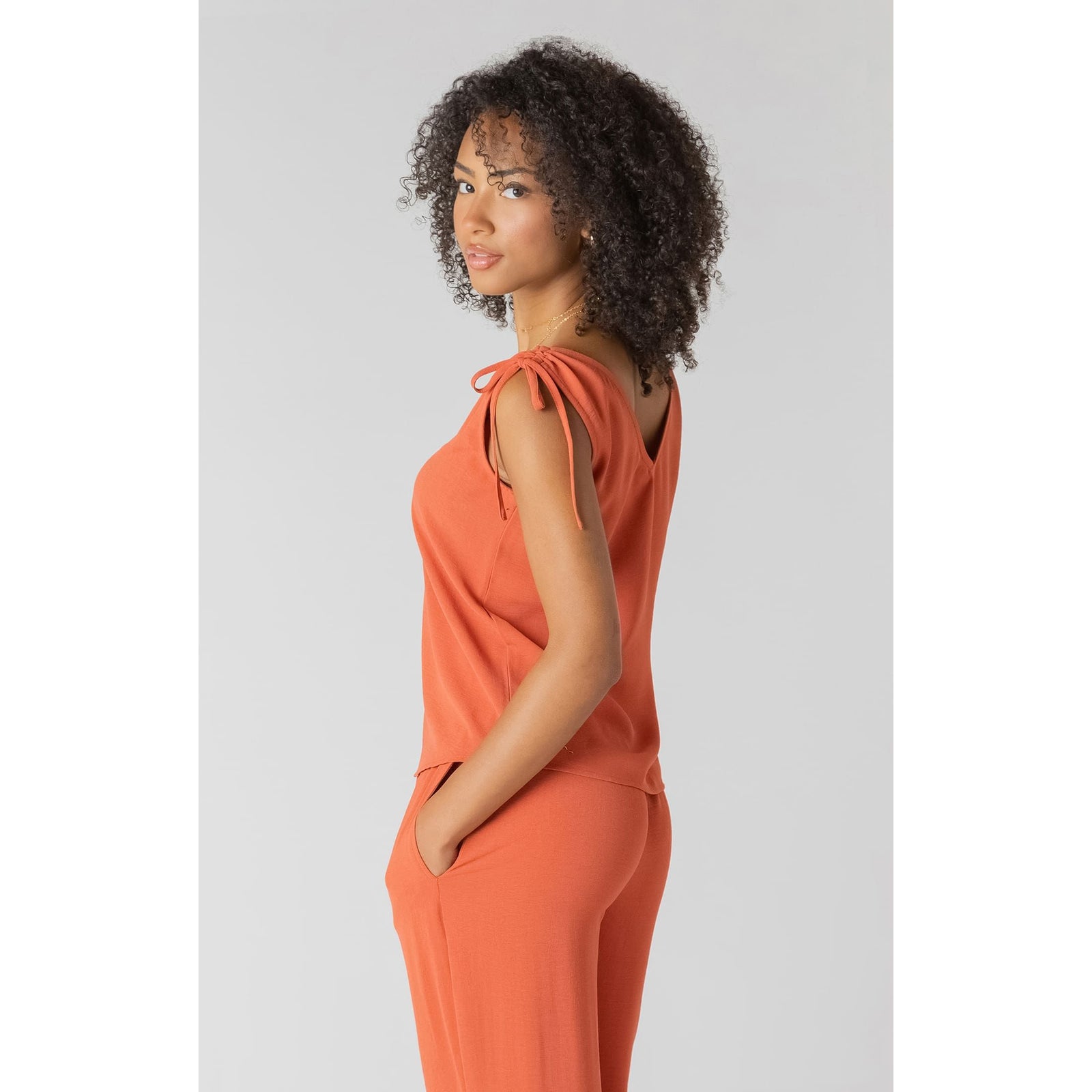 Room 34 V-Neck Top with Shoulder Ties in coral, sleeveless with adjustable shoulder ties and relaxed fit.