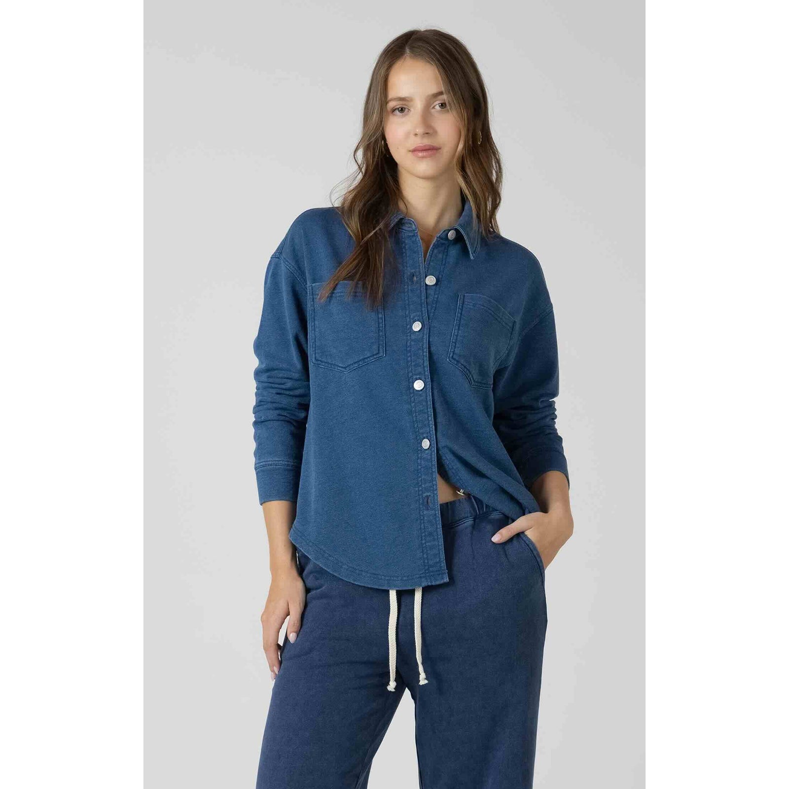 Dex Washed Knit Shirt in indigo knit, button-front with two chest pockets, paired with matching joggers on model.