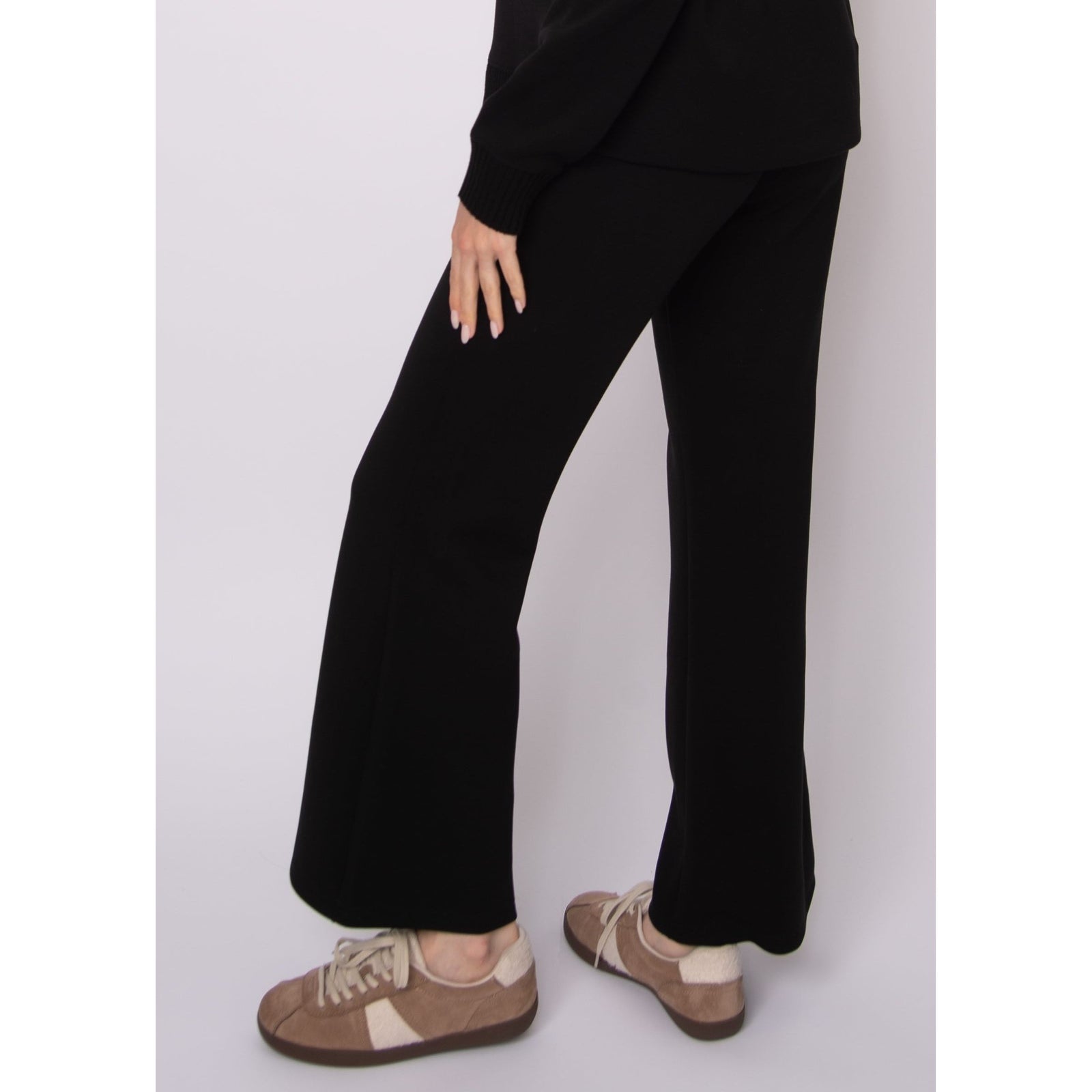 Florine Soft Knit Pull-On Flare Pants in black with a close-fitting leg and flared hem.