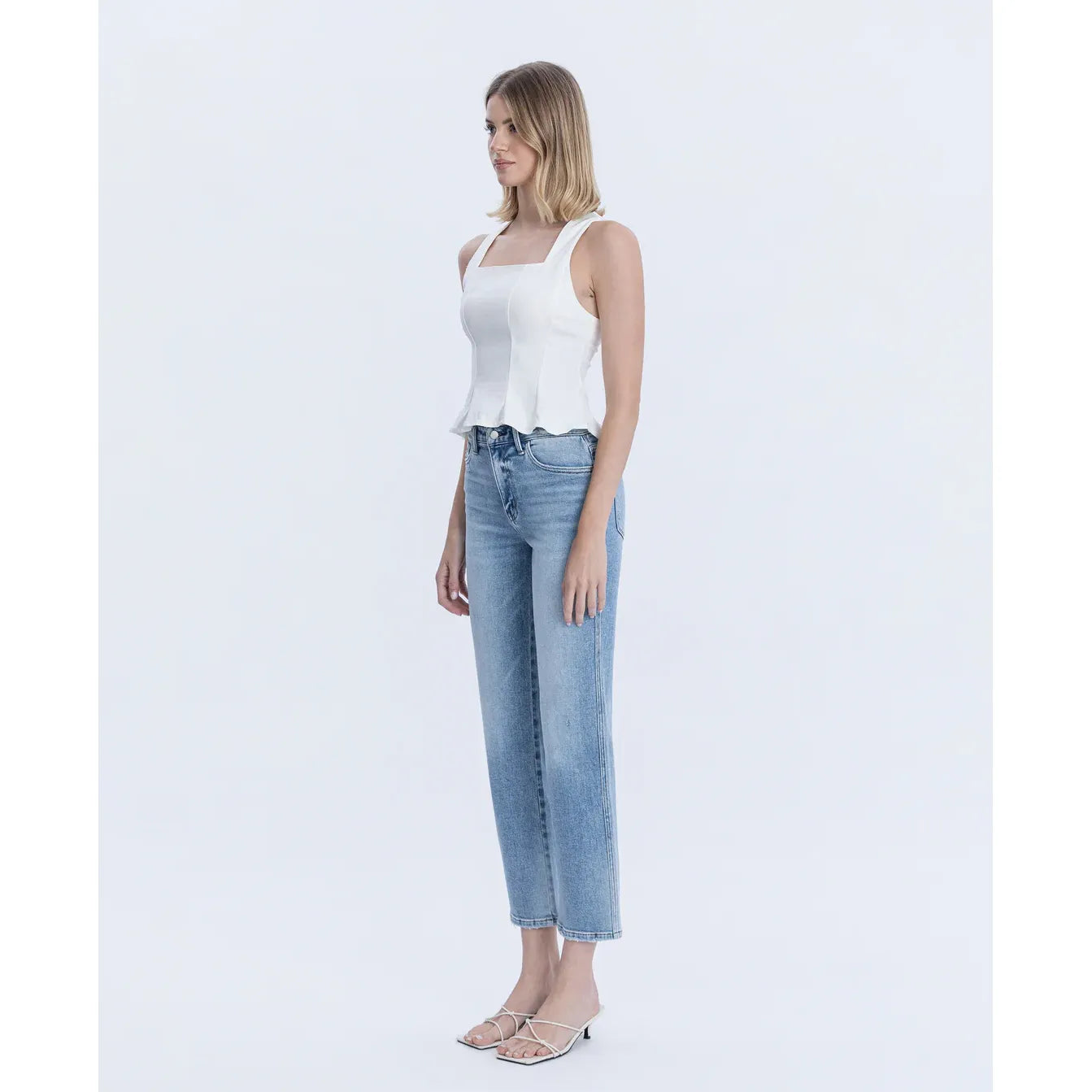 Flying Monkey Blissful Symphony high-rise ankle-straight jeans in light wash, paired with a white top.