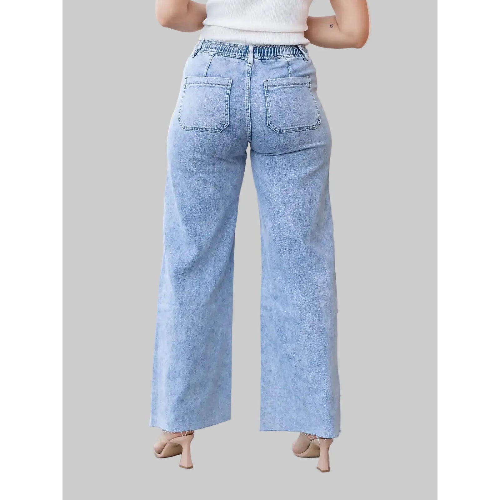 Flying Monkey Clearly High Rise Drawstring Wide Leg jeans in light wash denim, back patch pockets and signature patch.