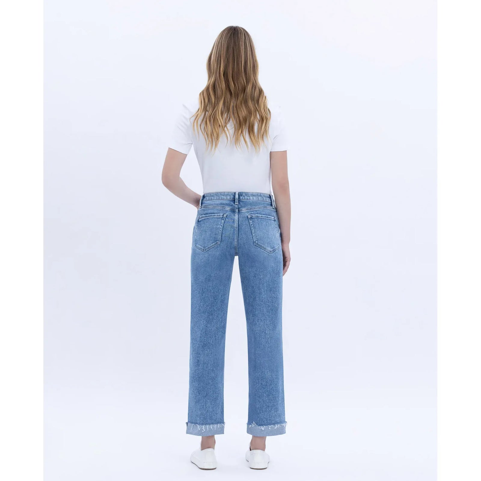 Model wearing Flying Monkey Delectable High Rise Straight Cuffed Crop jeans, back view, white top, frayed cuffs.