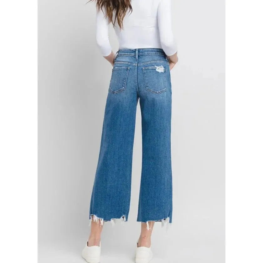 Stylish back view of Flying Monkey Delightful High Rise Crop Wide Leg Denim featuring a chic distressed hem.
