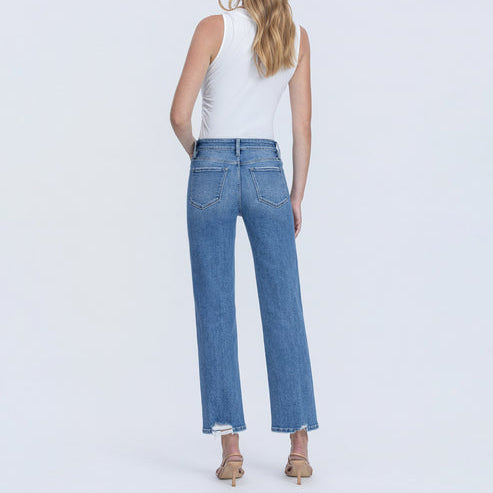 Back view of high rise ankle straight jeans featuring a distressed hem and classic five-pocket styling in medium blue wash.