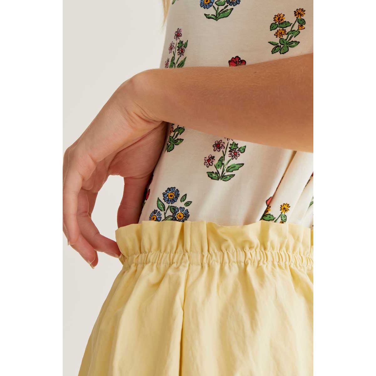 Gardener Print Tee featuring a whimsical multi-coloured botanical illustration on breathable cream cotton.
