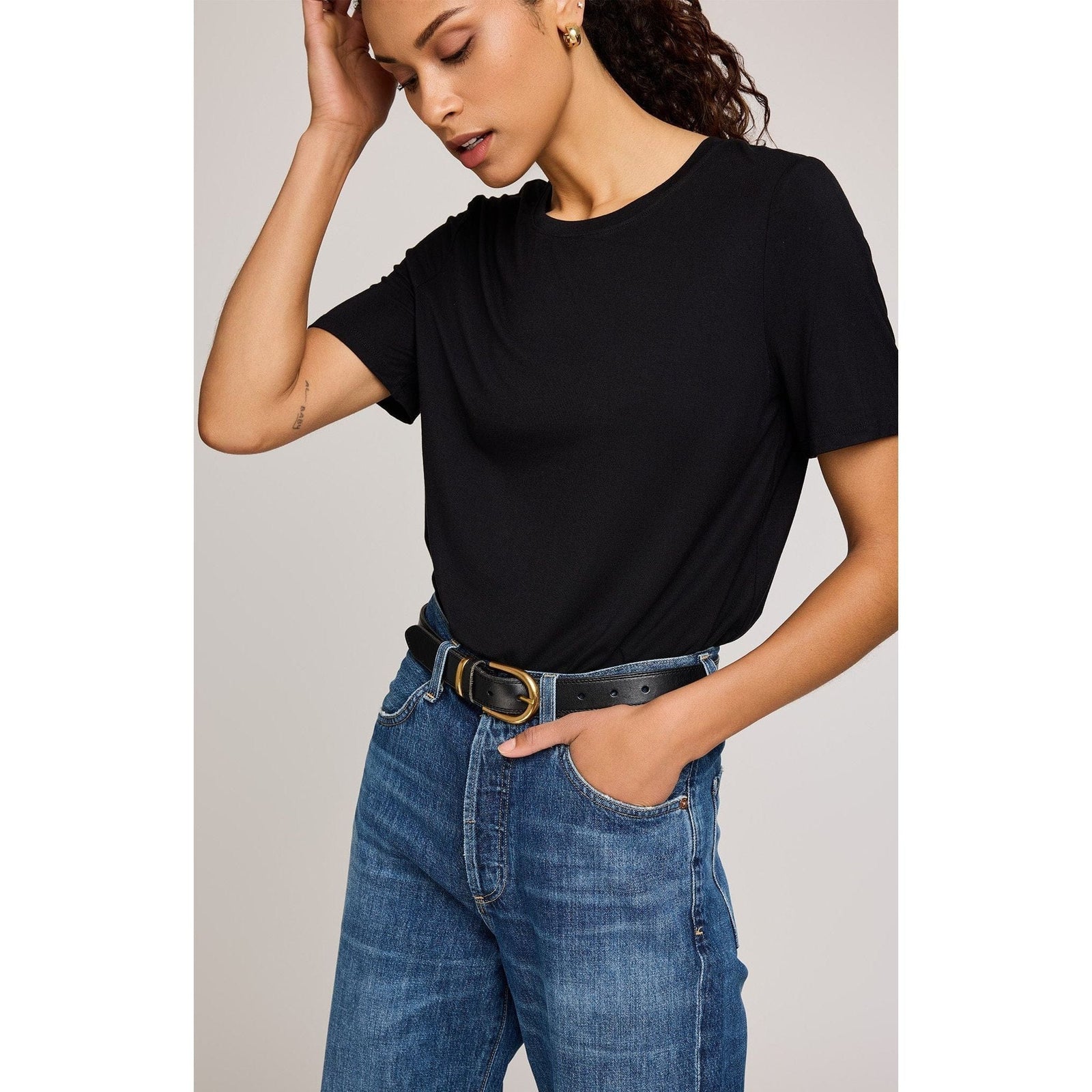 Gentle Fawn Brielle TShirt in black, soft EcoVero rayon jersey with crew neck and relaxed fit, shown with jeans.