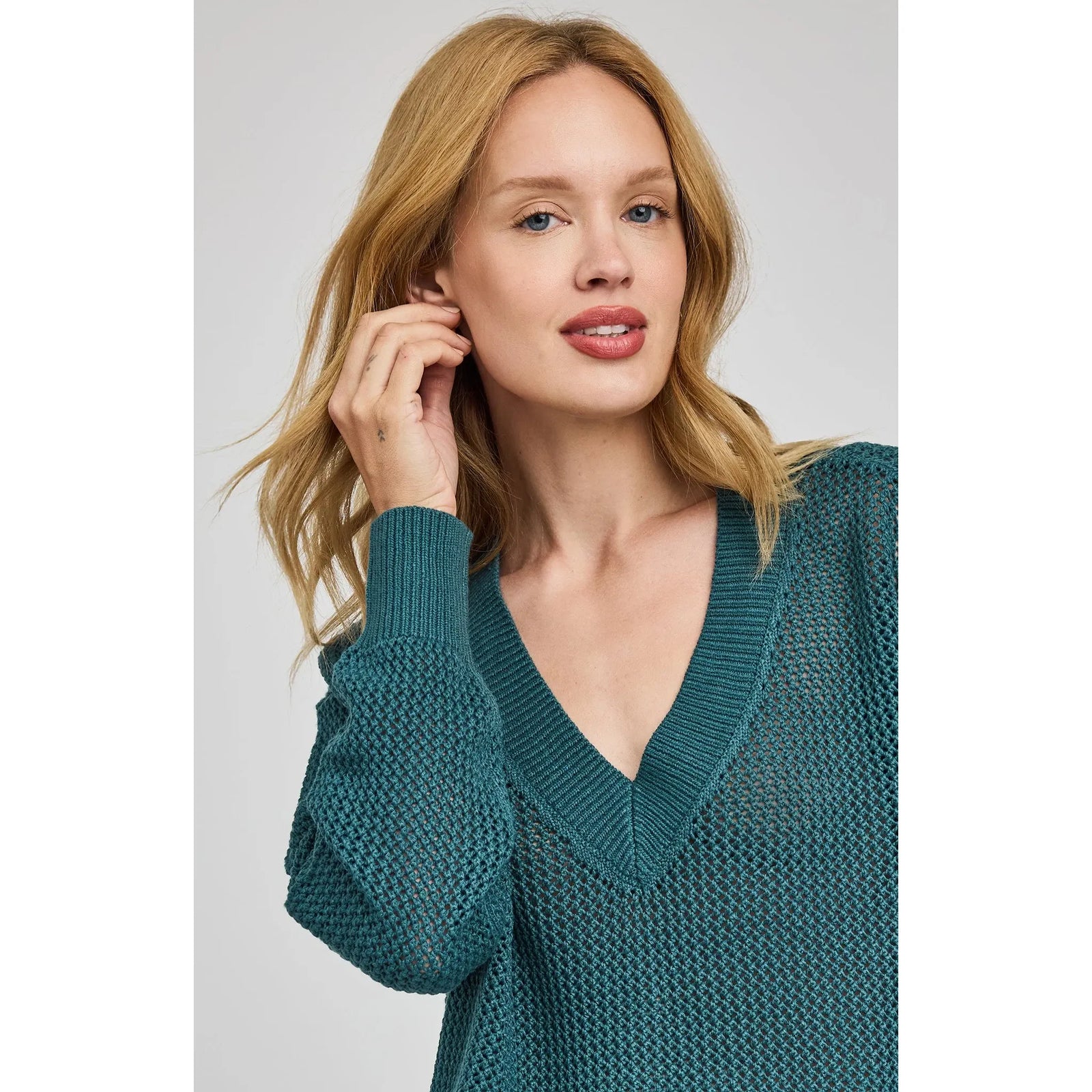 Model wearing Gentle Fawn Jensen V-Neck Pullover in teal open-knit with a relaxed fit.