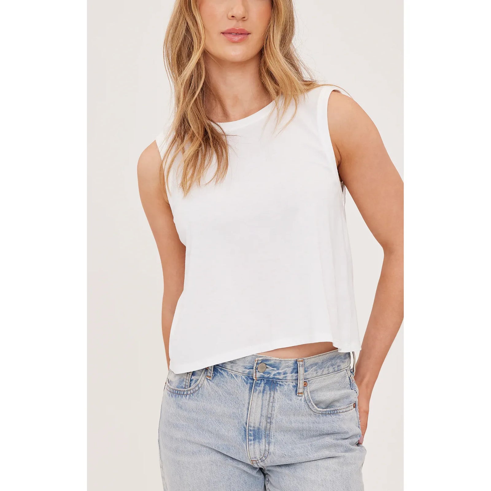Gentle Fawn Kate Tank in white cotton jersey, garment-dyed, relaxed sleeveless top worn with jeans.