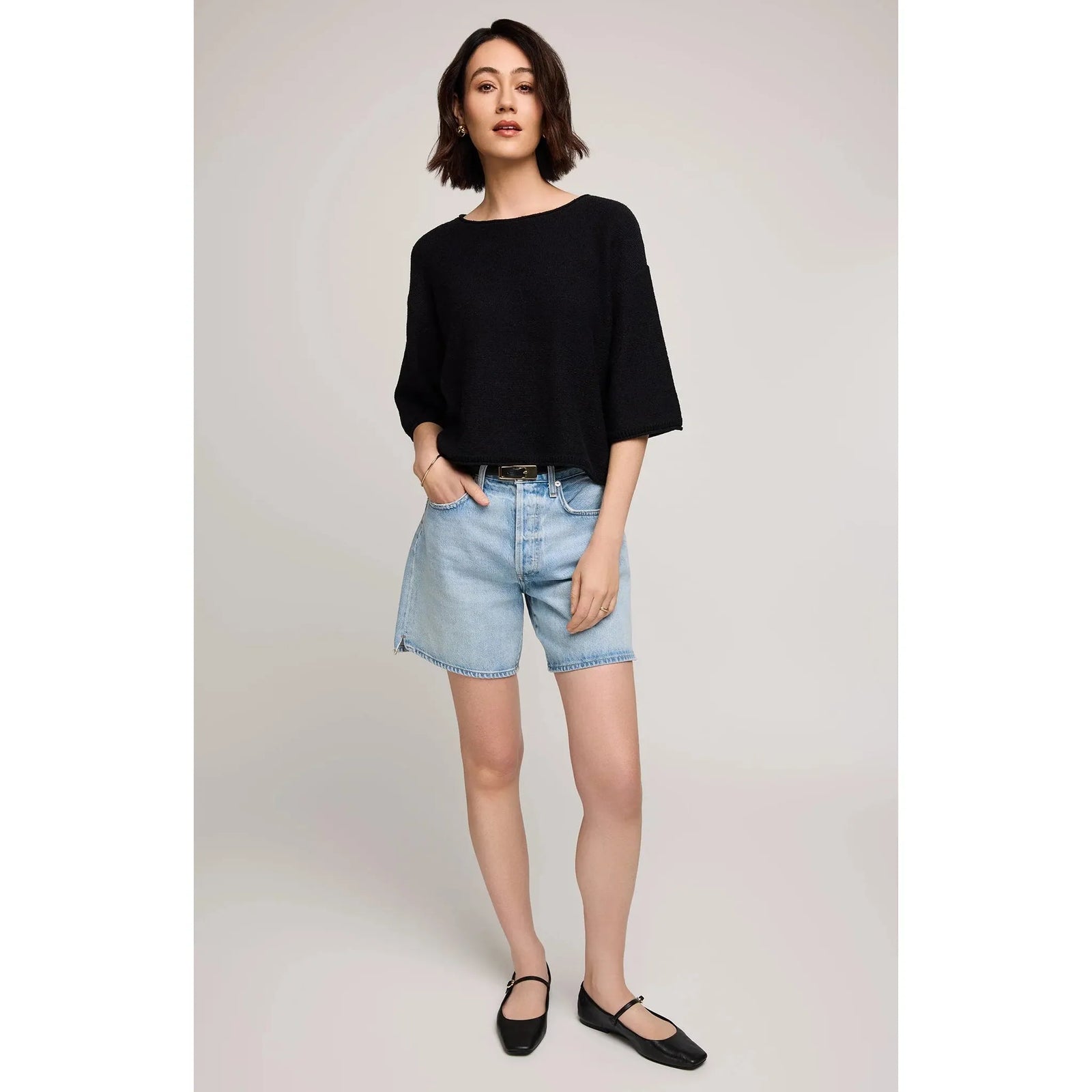 Gentle Fawn Kerrigan Sweater on a model: relaxed black knit with rolled hems, from Gentle Fawn.