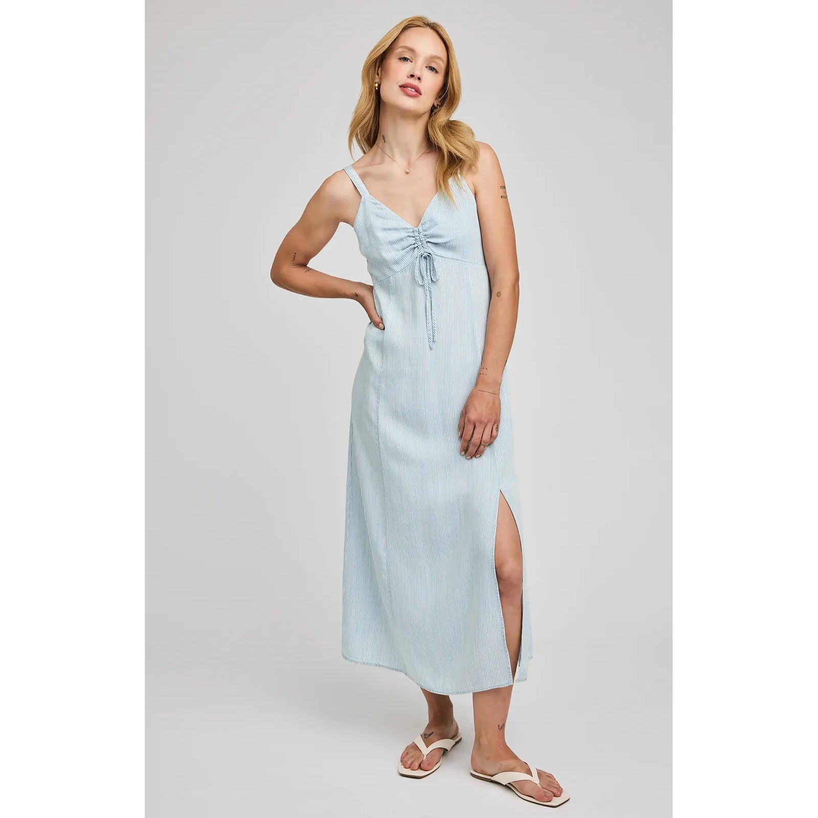 Gentle Fawn Renata Midi Dress in light blue stripe with ruched drawstring front, V-neck, and side slit.