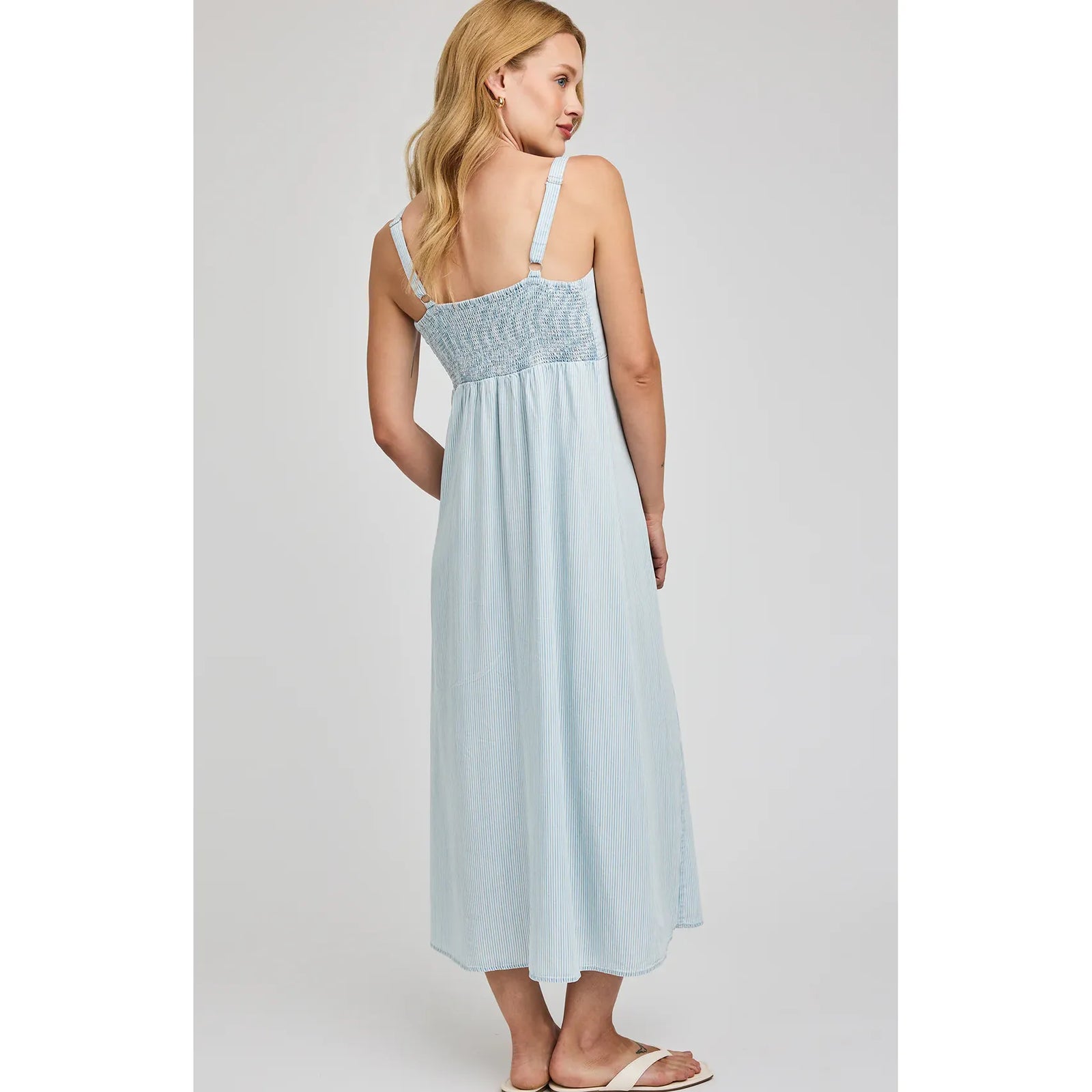 Gentle Fawn Renata Midi Dress in light blue stripes, back view with smocked bodice and adjustable straps.