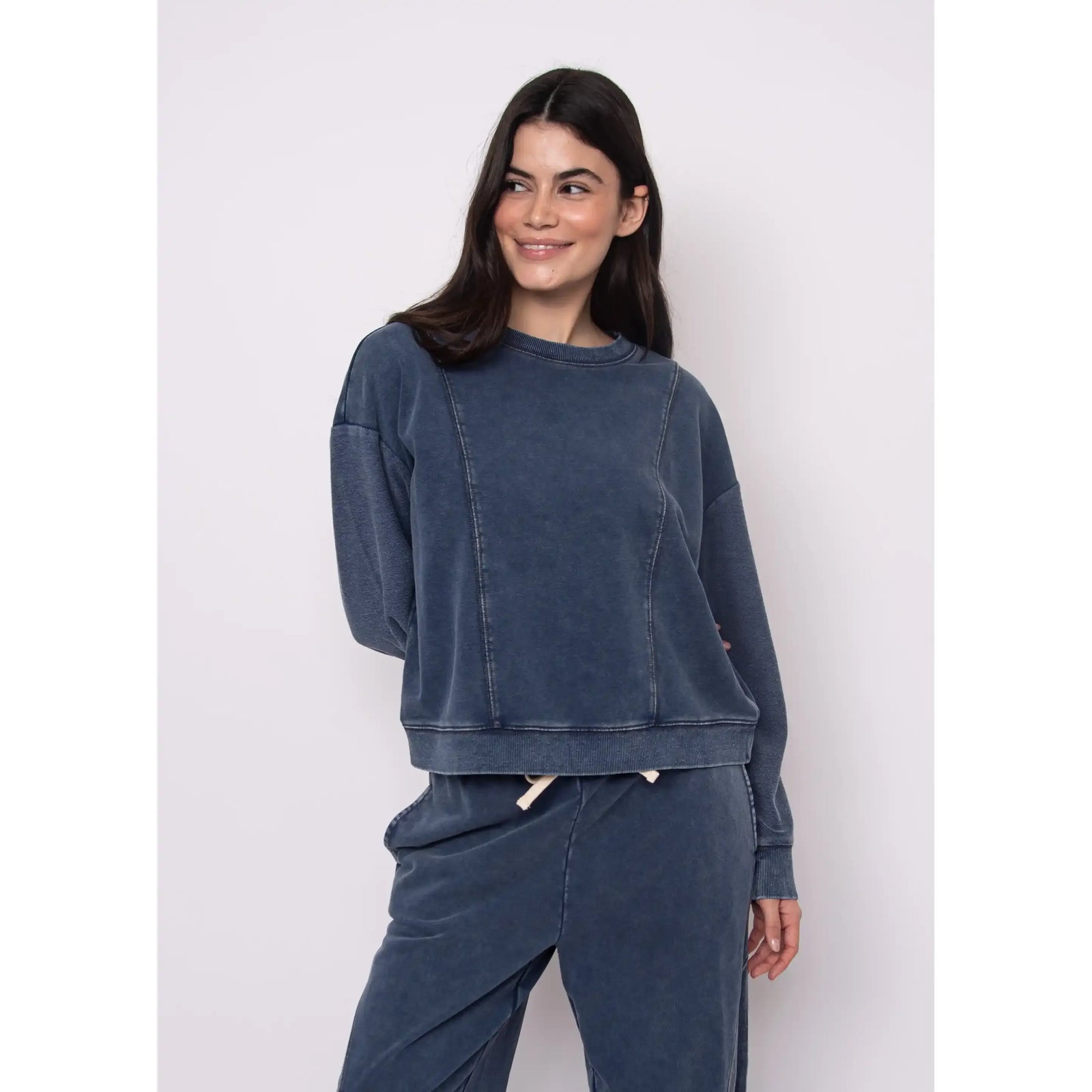 Blue denim-inspired Kacey French Terry pull-over top with matching joggers on a model.