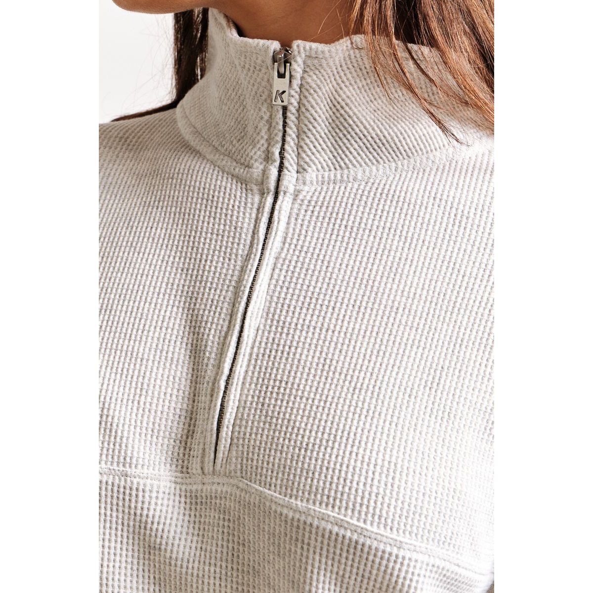 Kuwalla Bailey Waffle Zip Up in cream with textured waffle knit and half-zip collar.