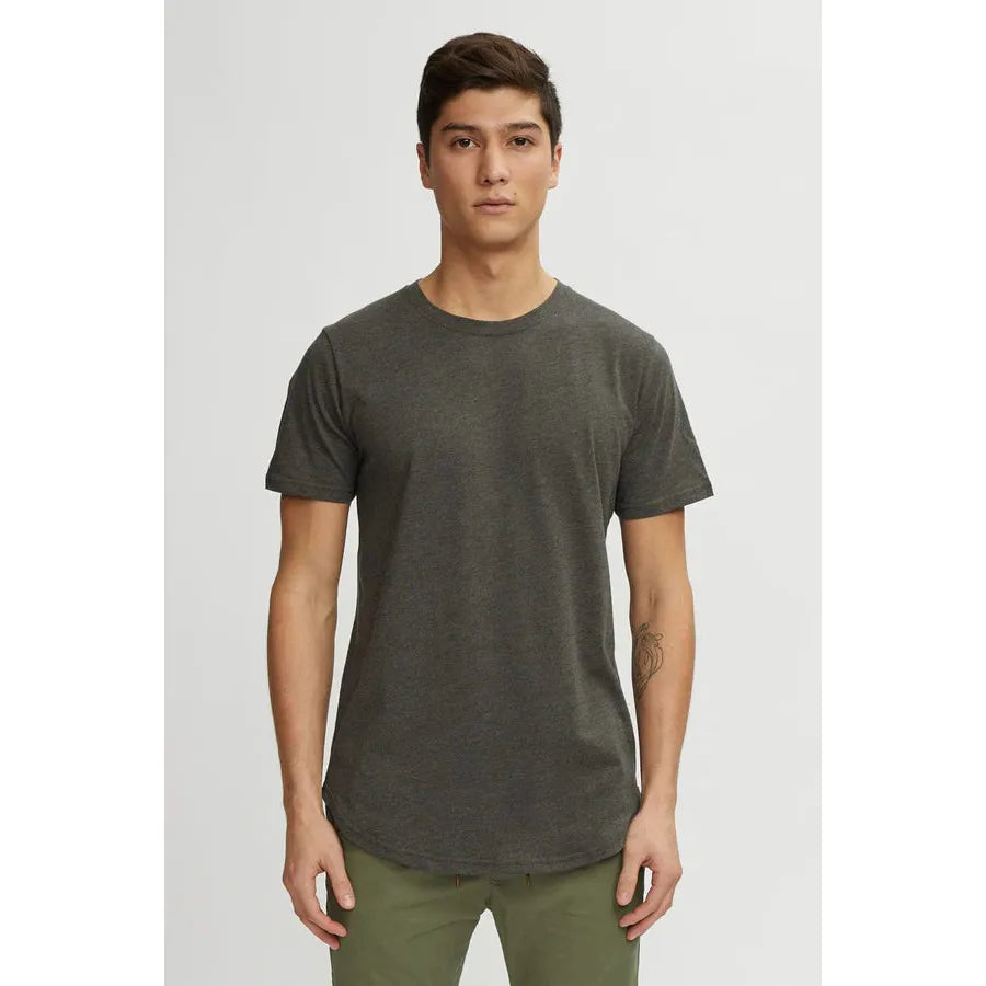 Kuwalla Scoop Tee in dark olive on model with scooped hem front and back.