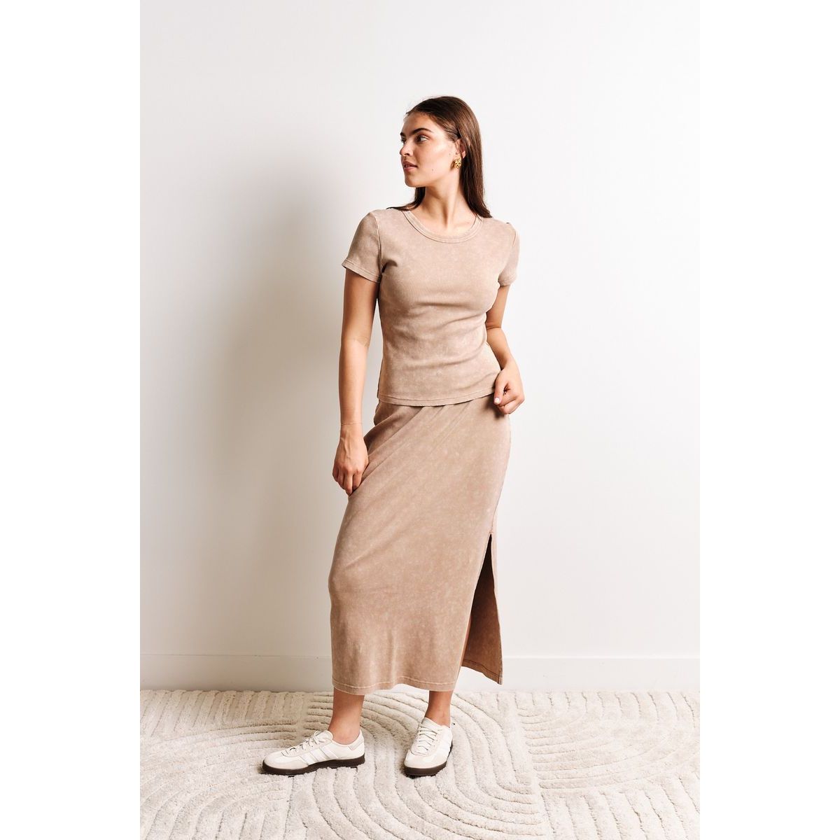 Kuwalla Pamerla Ribbed Shirt outfit on model in beige with matching skirt; wash cold, hang to dry; size chart