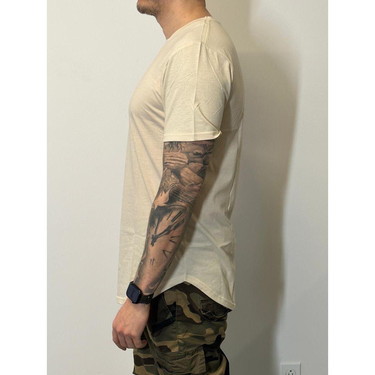 Kuwalla Scoop Tee in oatmeal on a side-profile model, features scooped hem front and back.