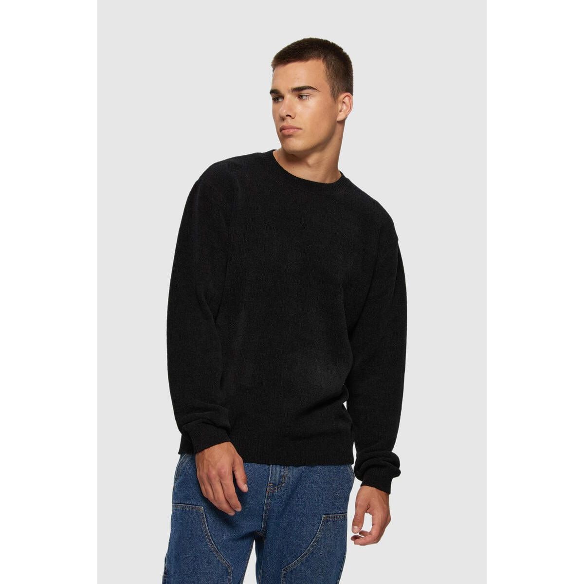 Kuwalla Textured Knit Crew in black on model; rib-knit collar and cuffs, Kuwalla Apparel.