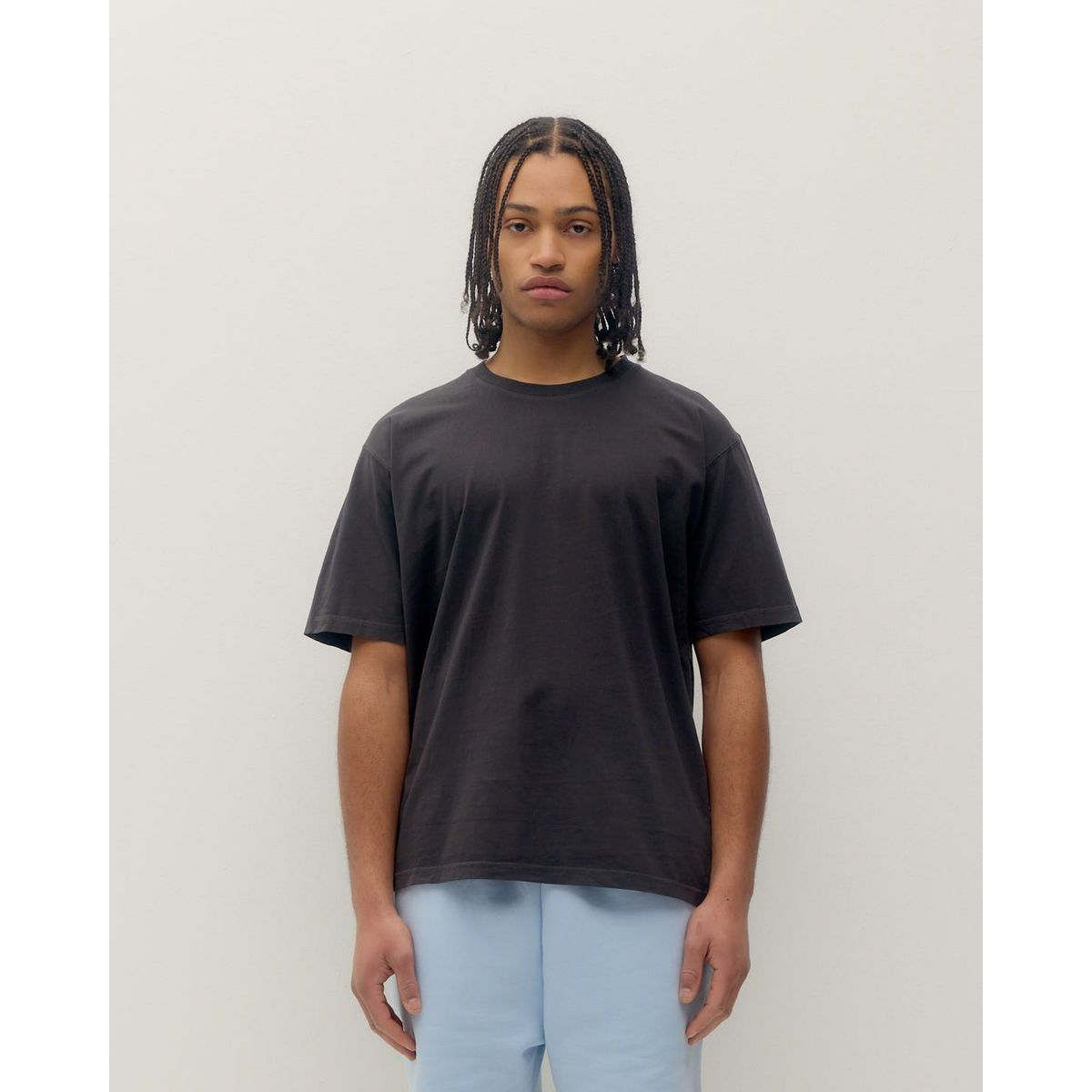 Kuwalla Vintage Tee in black with relaxed fit on a model for a casual summer vibe.