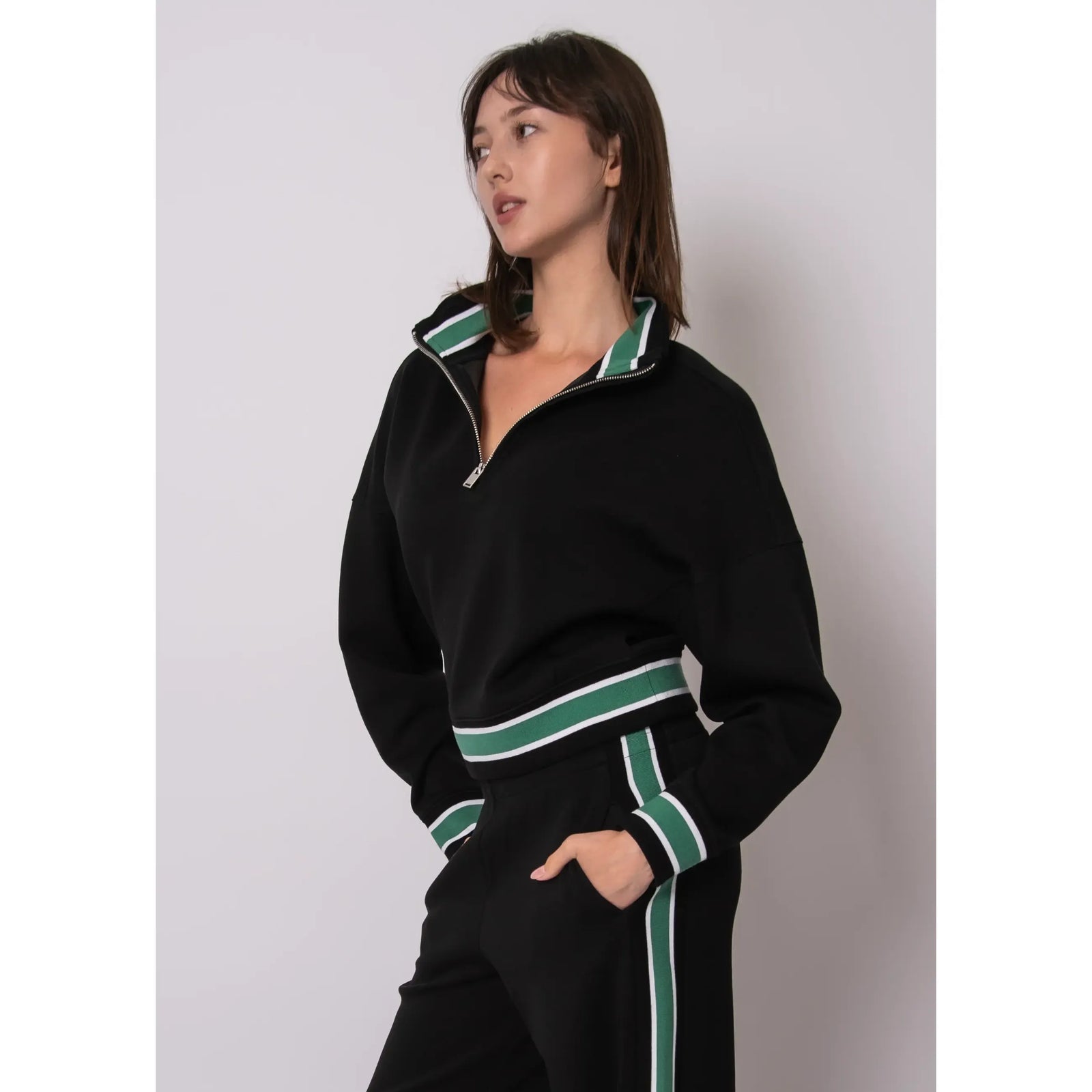 Mailyn Soft Knit Half Zip Pullover in black with green/white striped collar, cuffs, and hem.